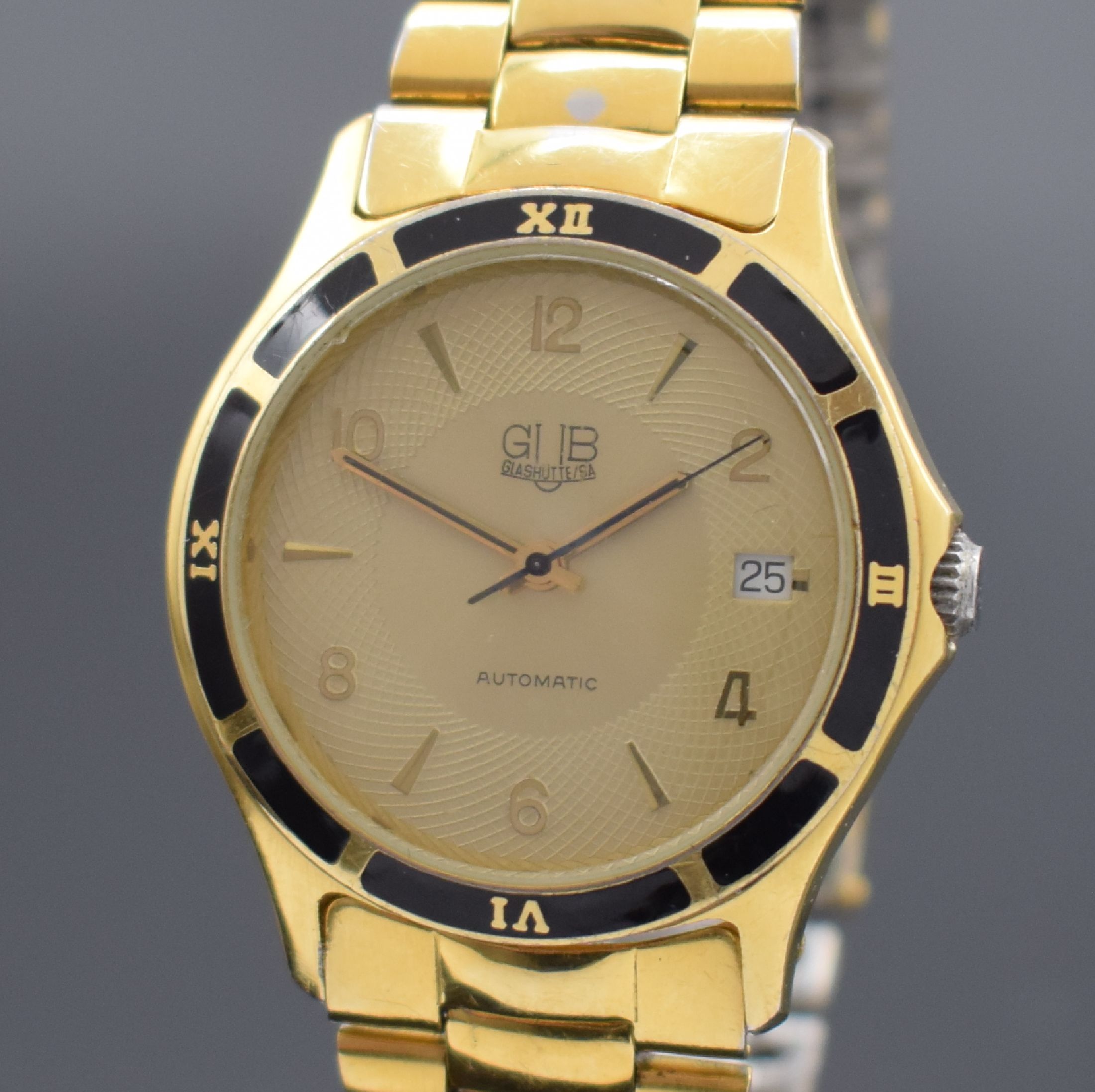 Detail a: GUB vergoldete Stahl Herrenarmbanduhr, Deutschland/Schweiz Anfang 1990er Jahre, Automatik, beids. vergl. Geh., Boden verschr., schwarze Lünette m. ...