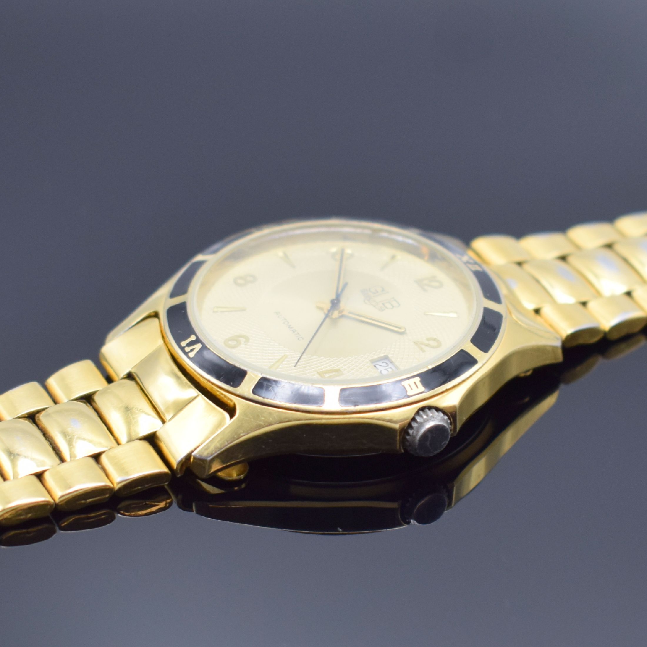 Detail b: GUB vergoldete Stahl Herrenarmbanduhr, Deutschland/Schweiz Anfang 1990er Jahre, Automatik, beids. vergl. Geh., Boden verschr., schwarze Lünette m. ...