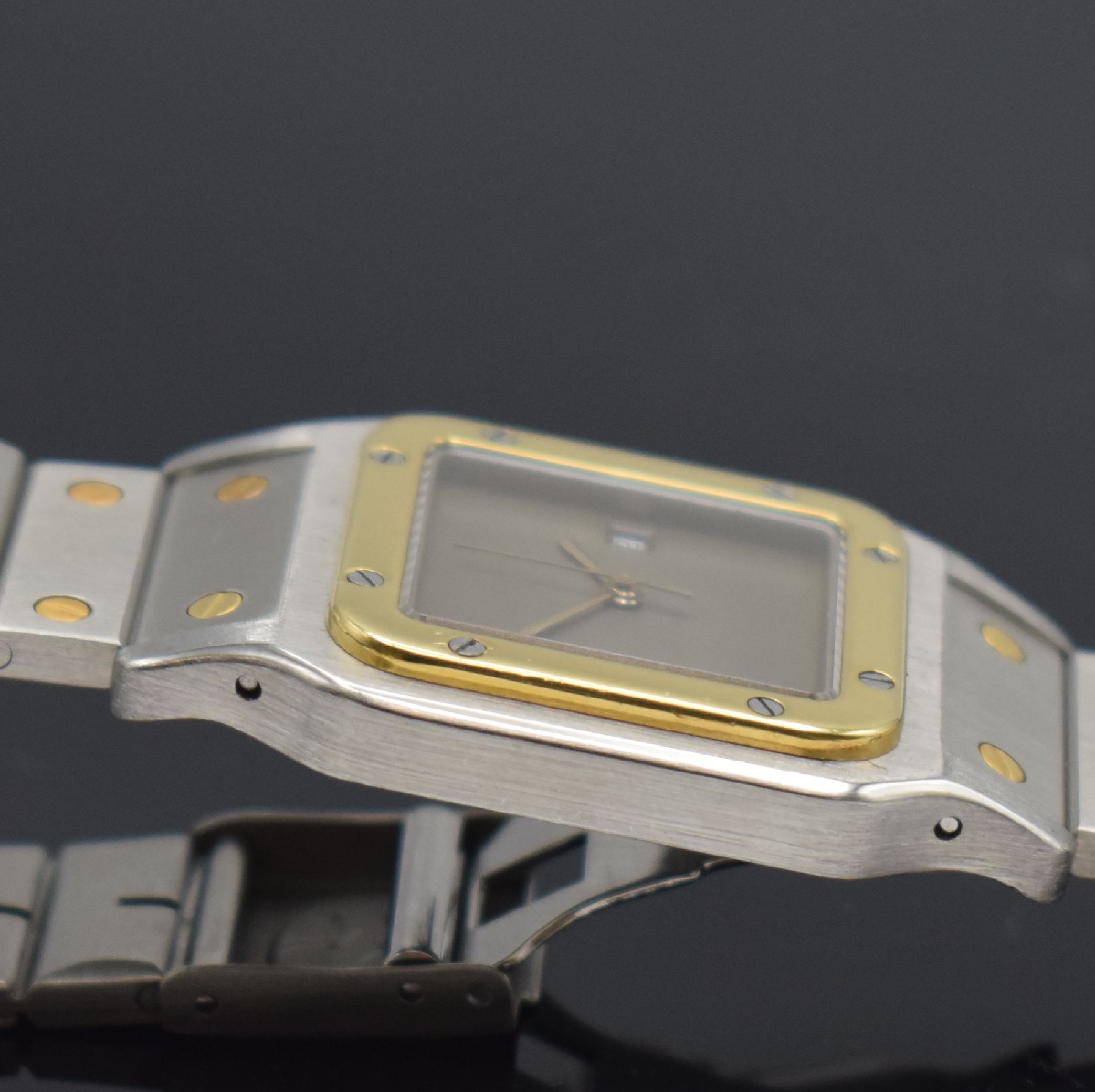 Detail f: CARTIER Santos Herrenarmbanduhr, Schweiz um 1985, Automatik, Edelstahl/Gold kombiniert inkl. Gliederband m. Faltschl., Monocoque- Geh., Lünette ...