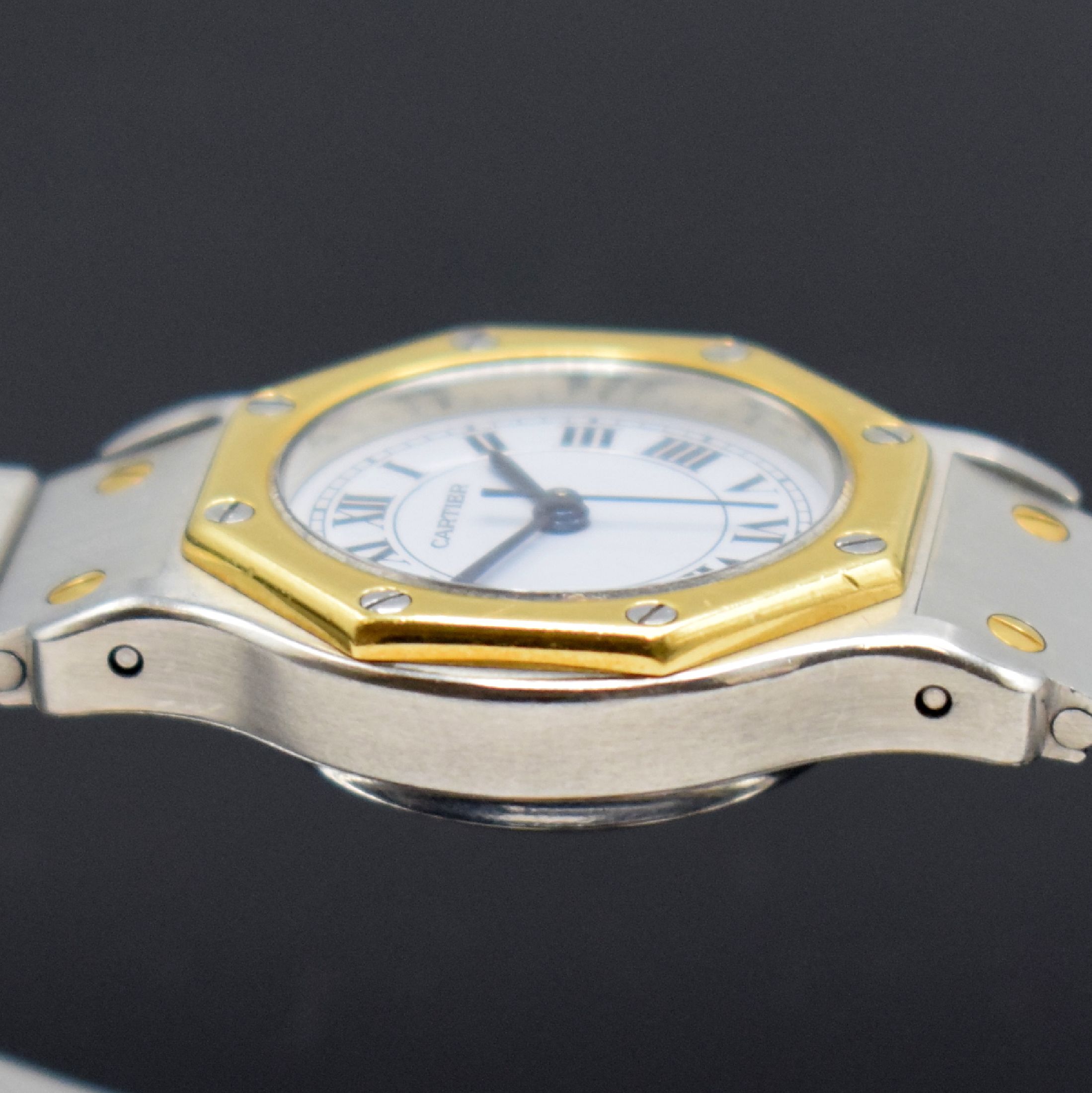 Detail e: CARTIER Santos Damenarmbanduhr, Schweiz um 1985, Automatik, Edelstahl/Gold kombiniert inkl. Gliederband m. Faltschl., Monocoque- Geh., Lünette ...