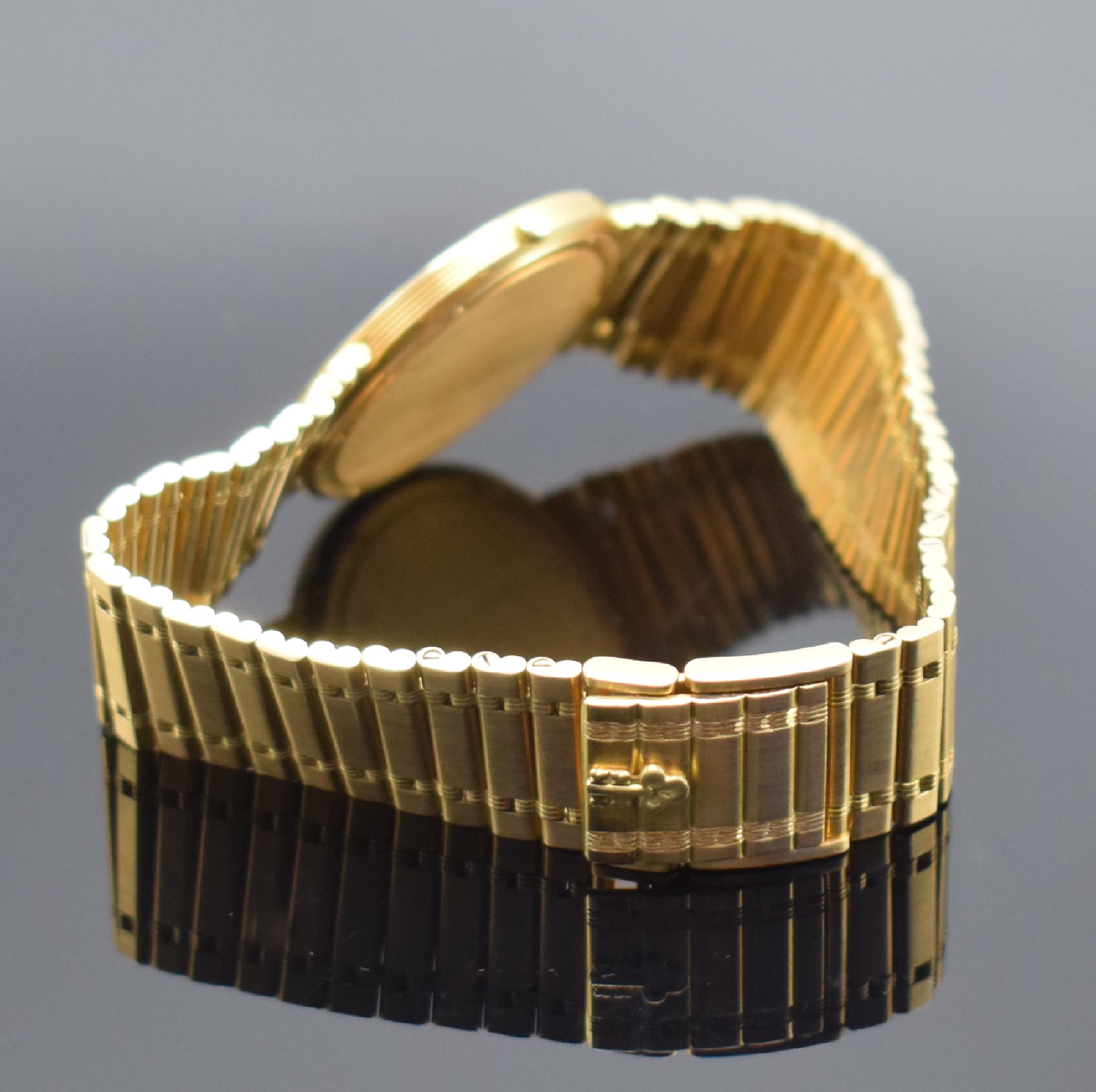 Detail b: CORUM Herrengoldbanduhr Serie Romulus in GG 750/000 Referenz 50.503.56 V-48, Schweiz um 1988, GG 750/000 Gliederband, Boden 6-fach verschr., ...
