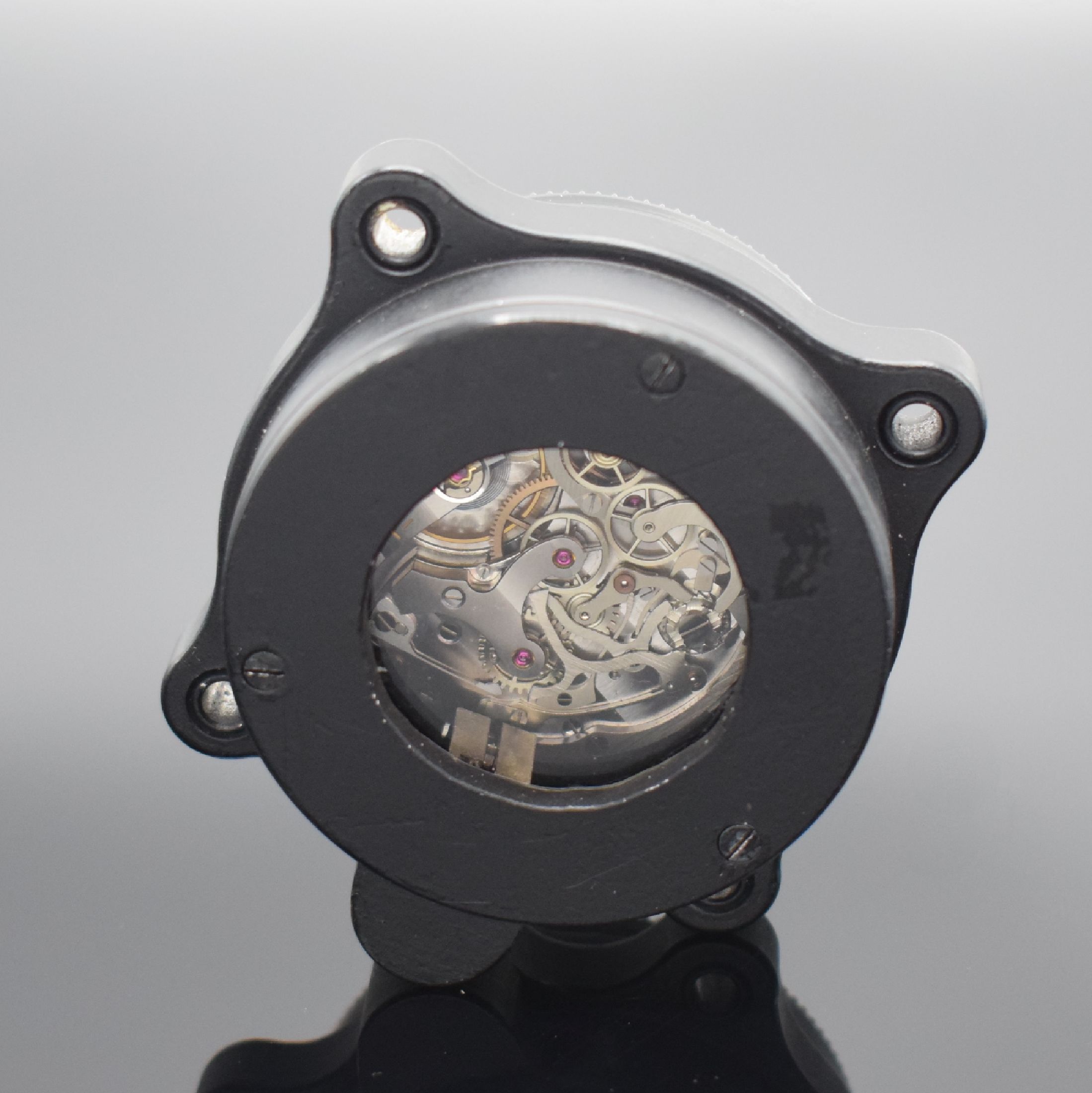 Detail c: Einbauborduhr mit Schaltradchronograph Kaliber Valjoux 5, Schweiz um 1965, geschwärztes Aluminium-Geh., vergl. Boden 3-fach verschr., innenliegende ...
