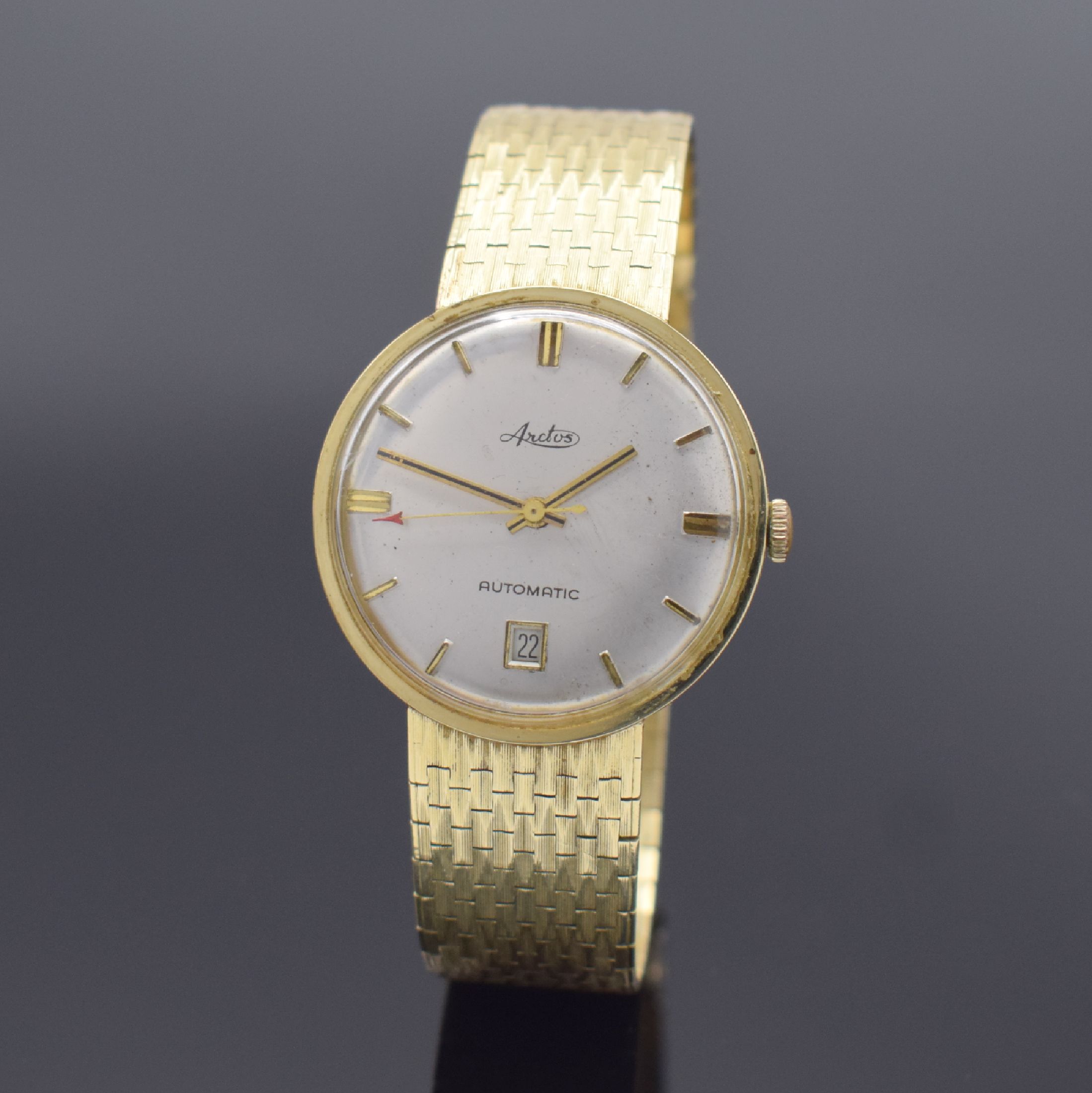 ARCTOS Herrenarmbanduhr in GG 585/000, Schweiz um 1965, Automatik, Boden aufgedr., silb. Zifferbl. m. gold. Std.-Ind. und Zeigern, Datum b. 6, ...