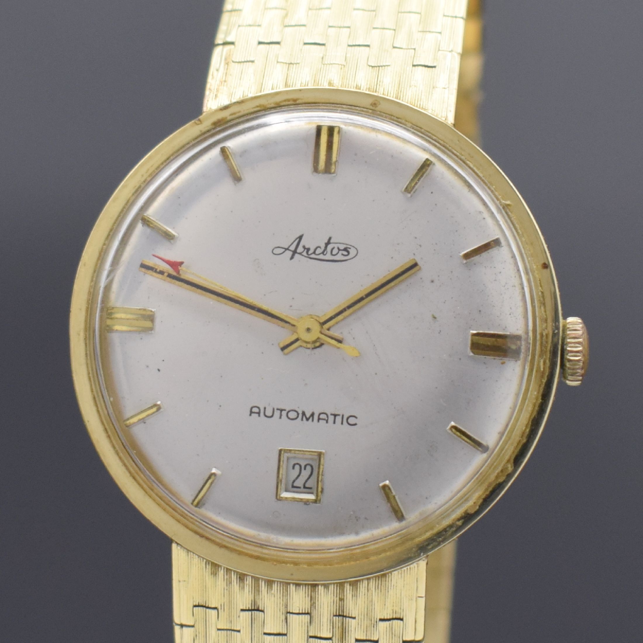 Detail a: ARCTOS Herrenarmbanduhr in GG 585/000, Schweiz um 1965, Automatik, Boden aufgedr., silb. Zifferbl. m. gold. Std.-Ind. und Zeigern, Datum b. 6, ...