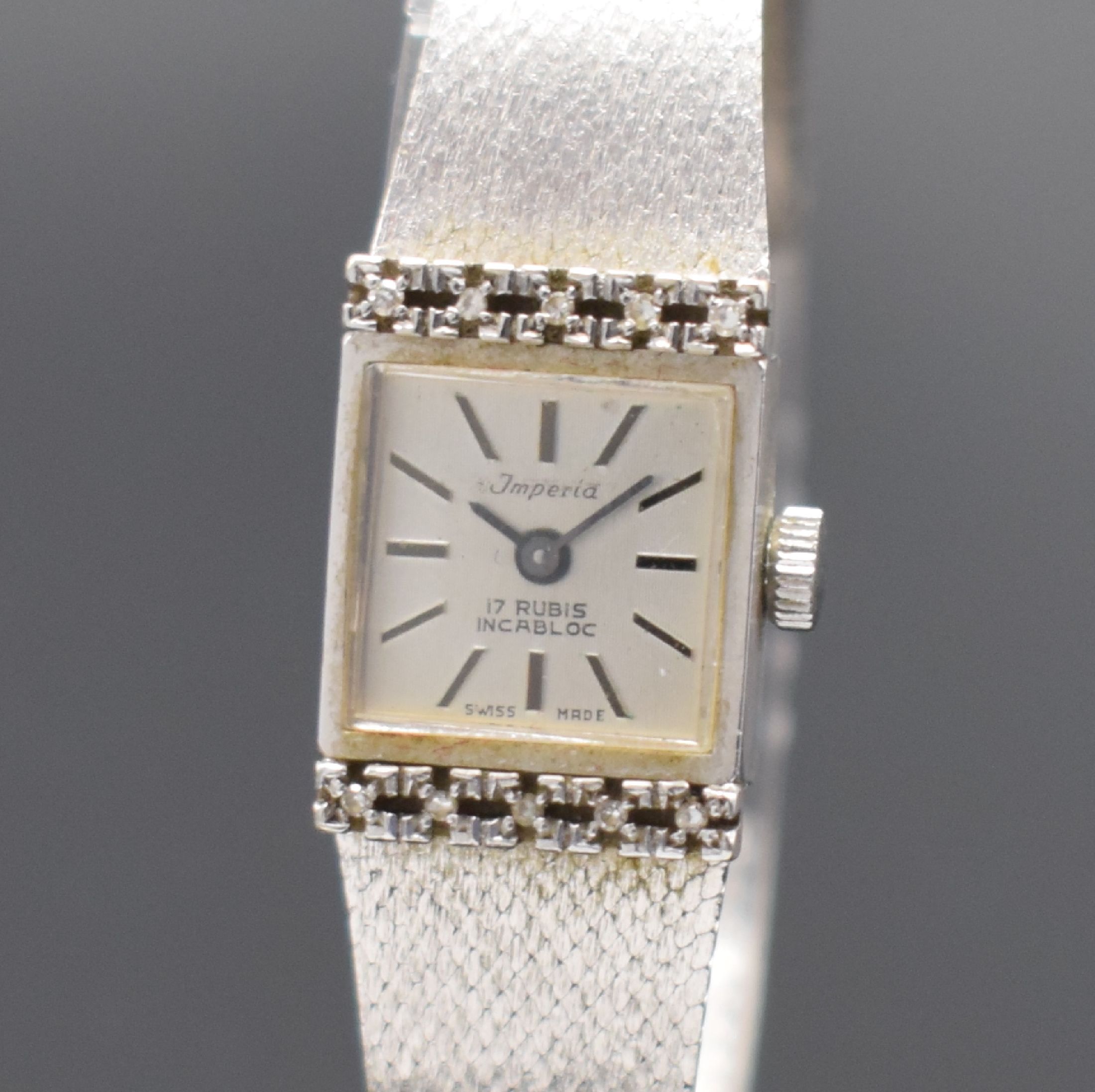 Detail a: IMPERIA Damenarmbanduhr in WG 585/000, Schweiz verk. lt. beil. Garantieschein 10/1974, Handaufzug, Boden aufgedr., Anstöße m. Diamanten bes., silb. ...