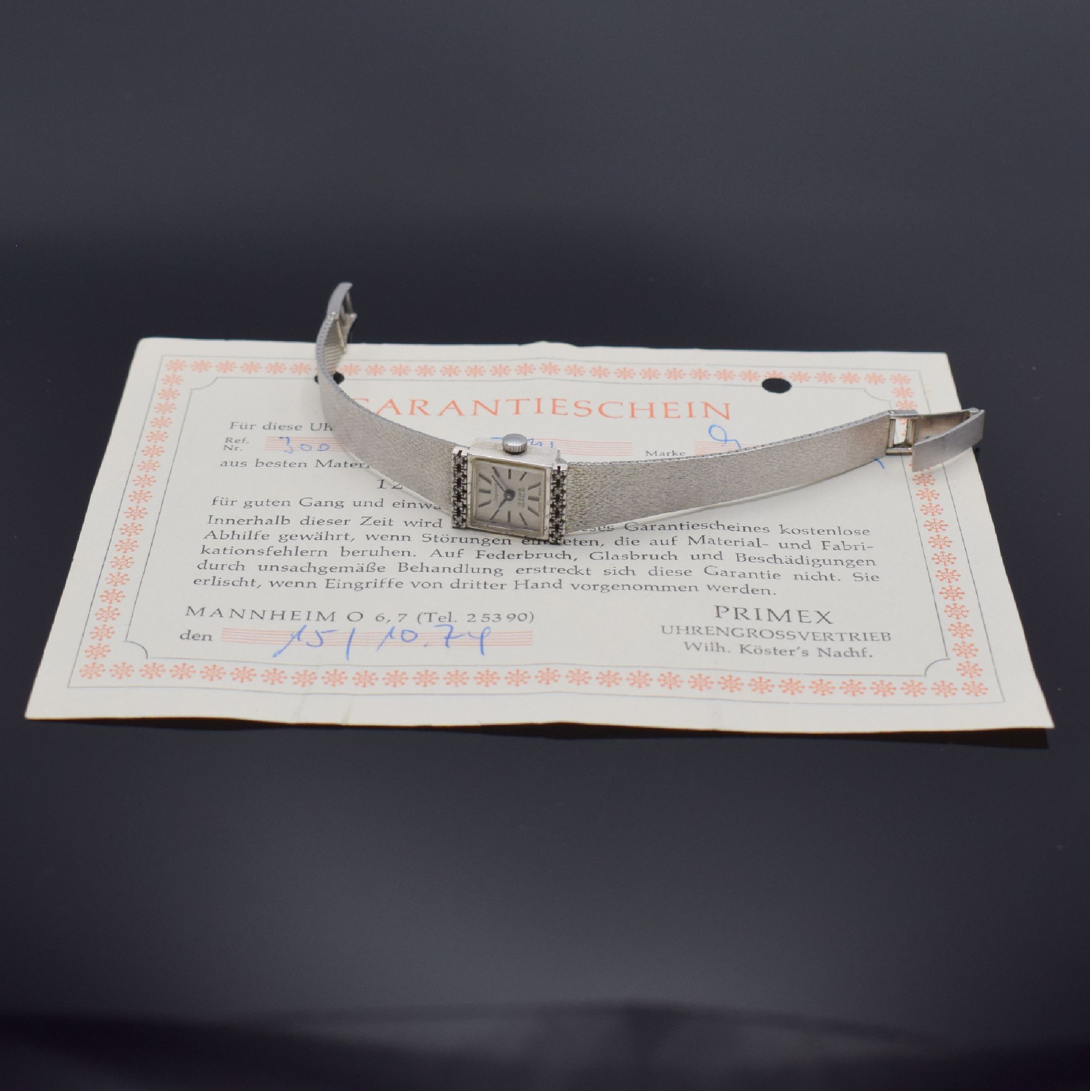 Detail d: IMPERIA Damenarmbanduhr in WG 585/000, Schweiz verk. lt. beil. Garantieschein 10/1974, Handaufzug, Boden aufgedr., Anstöße m. Diamanten bes., silb. ...
