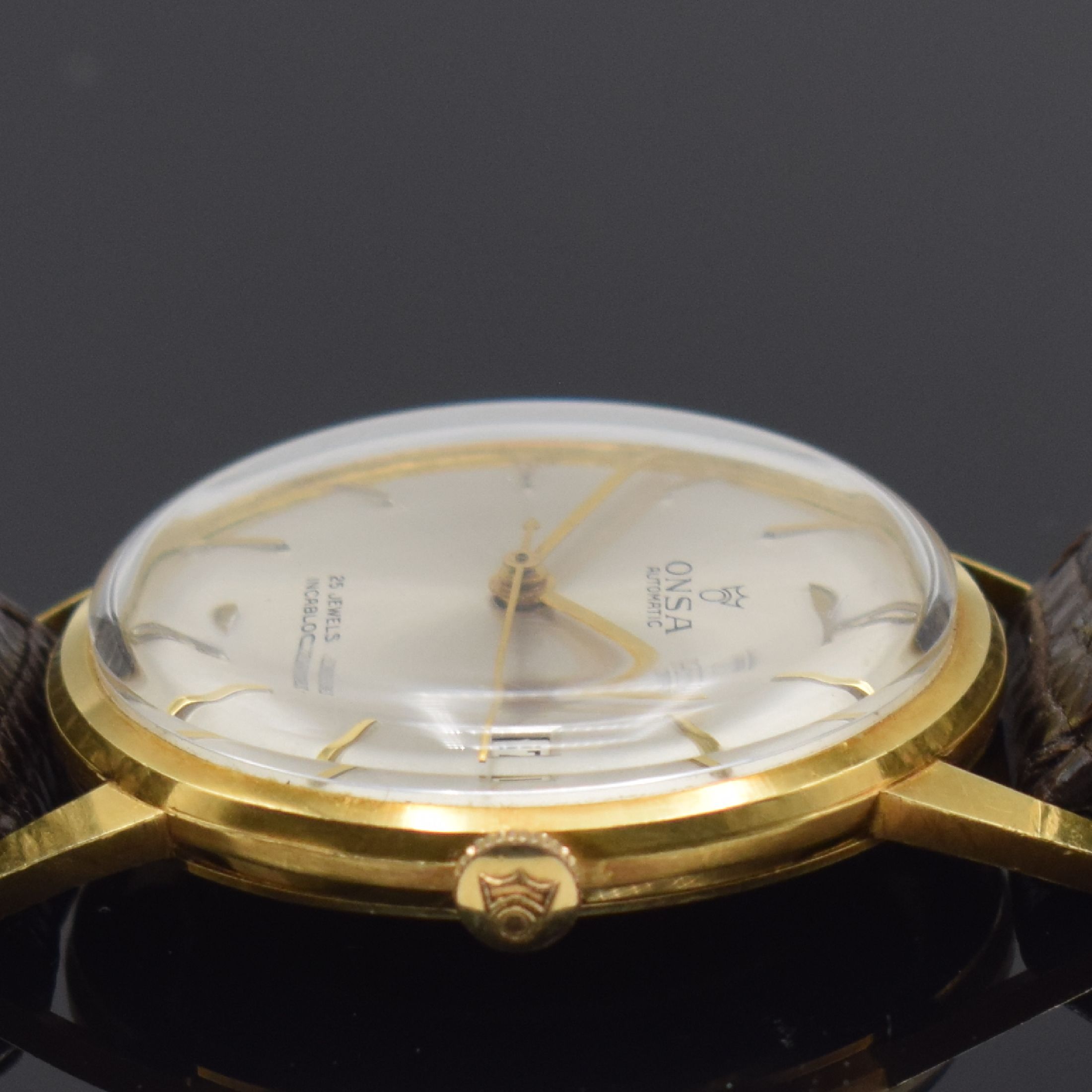 Detail c: ONSA in GG 750/000 und RENO im vergoldeten Gehäuse, 2 Herrenarmbanduhren, Schweiz und Deutschland um 1960, beide Automatik, Böden aufgedr., 1) ONSA ...