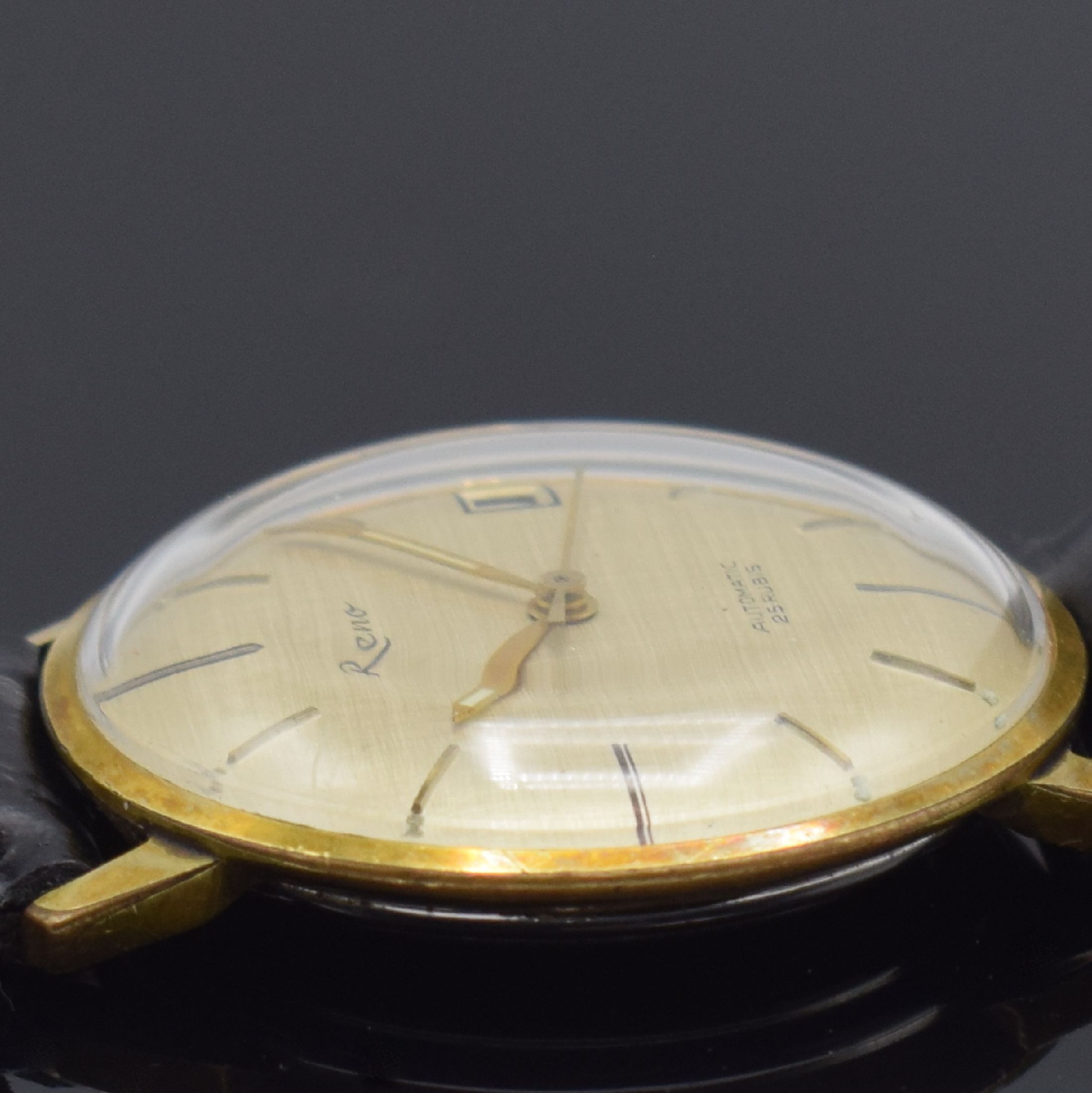 Detail g: ONSA in GG 750/000 und RENO im vergoldeten Gehäuse, 2 Herrenarmbanduhren, Schweiz und Deutschland um 1960, beide Automatik, Böden aufgedr., 1) ONSA ...