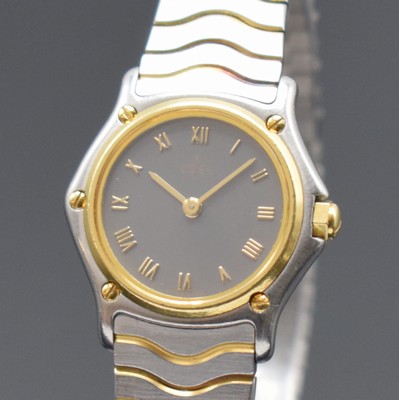 26591618a - EBEL ladies wristwatch Classic Wave reference 1057901, quartz, stainless steel/gold combined including wave bracelet with deployant clasp, bezel screwed down 5-times against case, gray dial with Roman numerals, gilded hands, diameter approx. 24 mm, length approx. 17 cm, condition 2