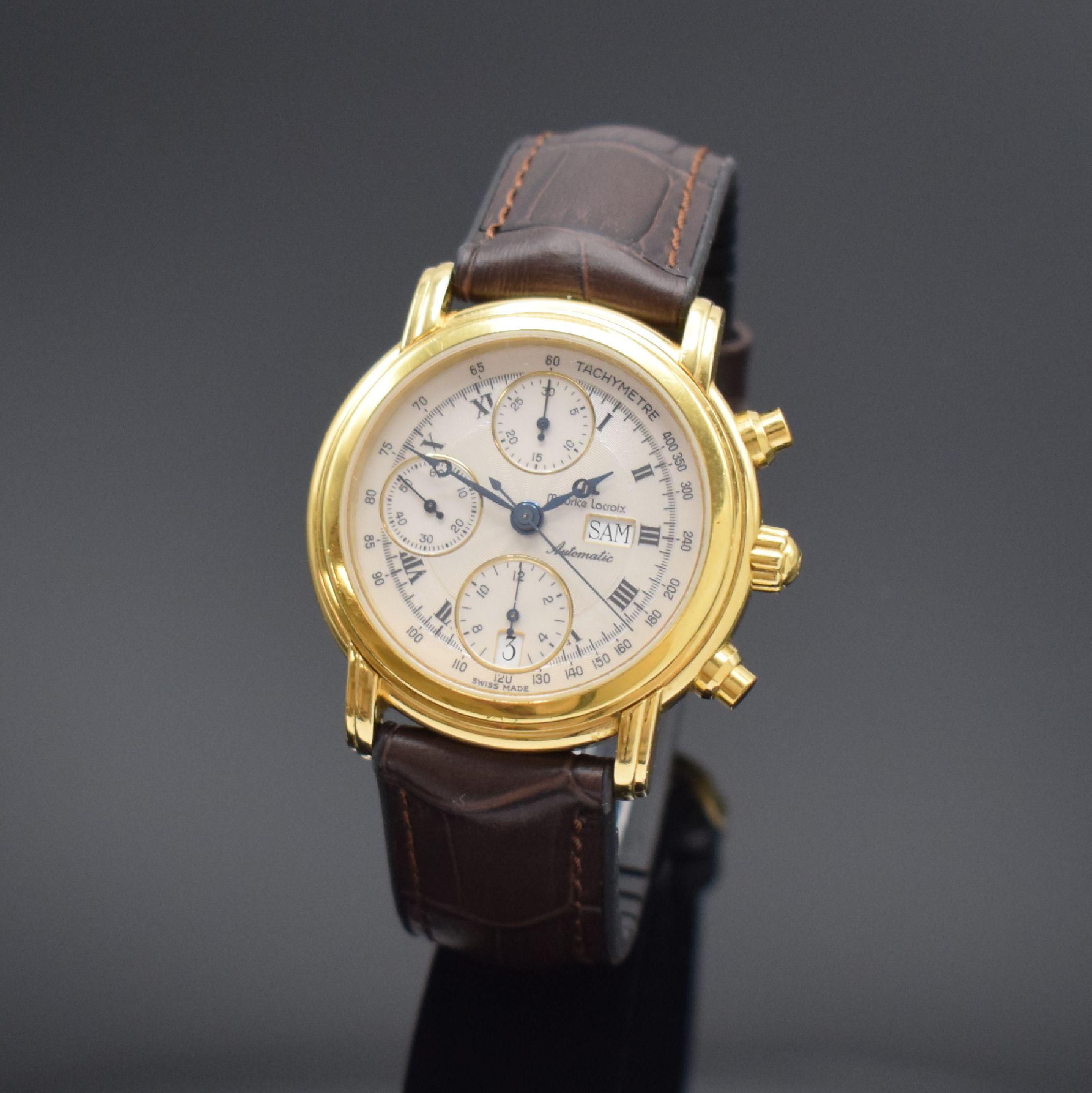 MAURICE LACROIX Herrenarmbanduhr mit Chronograph, Schweiz um 1995, Automatik, verg. Geh., Boden aufgedr., Lederband m. orig. Dornschl., guill. silb. ...