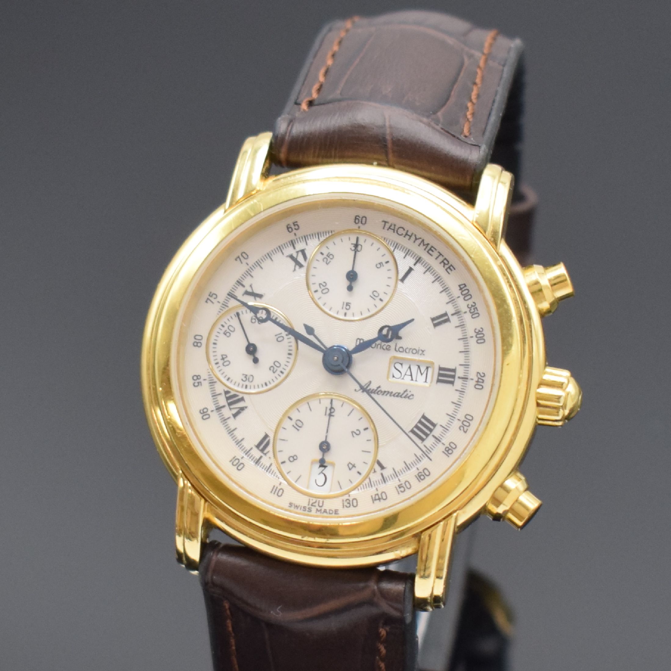 Detail a: MAURICE LACROIX Herrenarmbanduhr mit Chronograph, Schweiz um 1995, Automatik, verg. Geh., Boden aufgedr., Lederband m. orig. Dornschl., guill. silb. ...