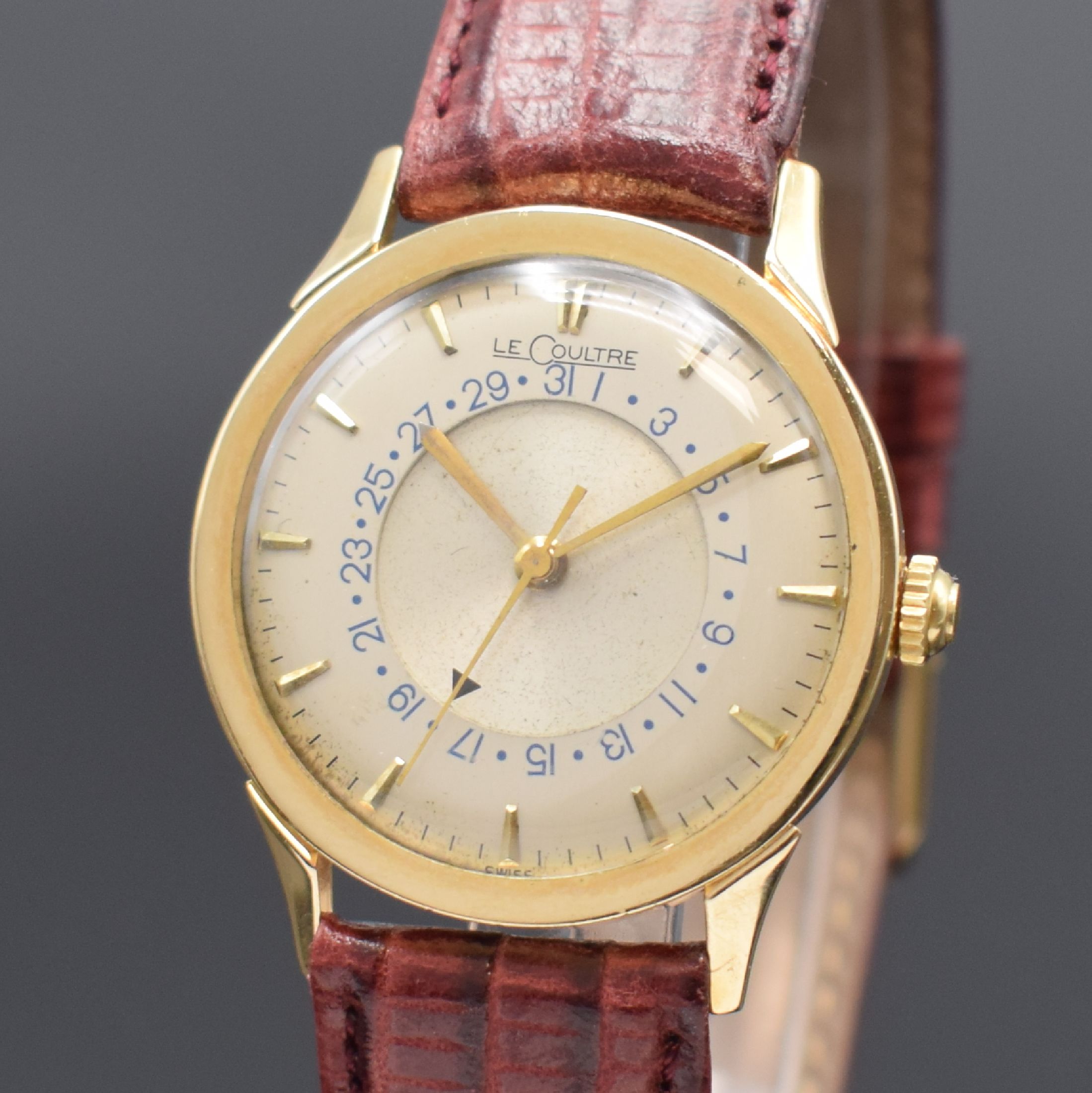 Detail a: LeCOULTRE Herrenarmbanduhr in GG 585/000, Schweiz für US-Markt, um 1950, Handaufzug, Boden aufgedr., silb. Zifferbl. m. zentraler Drehscheibe f. ...