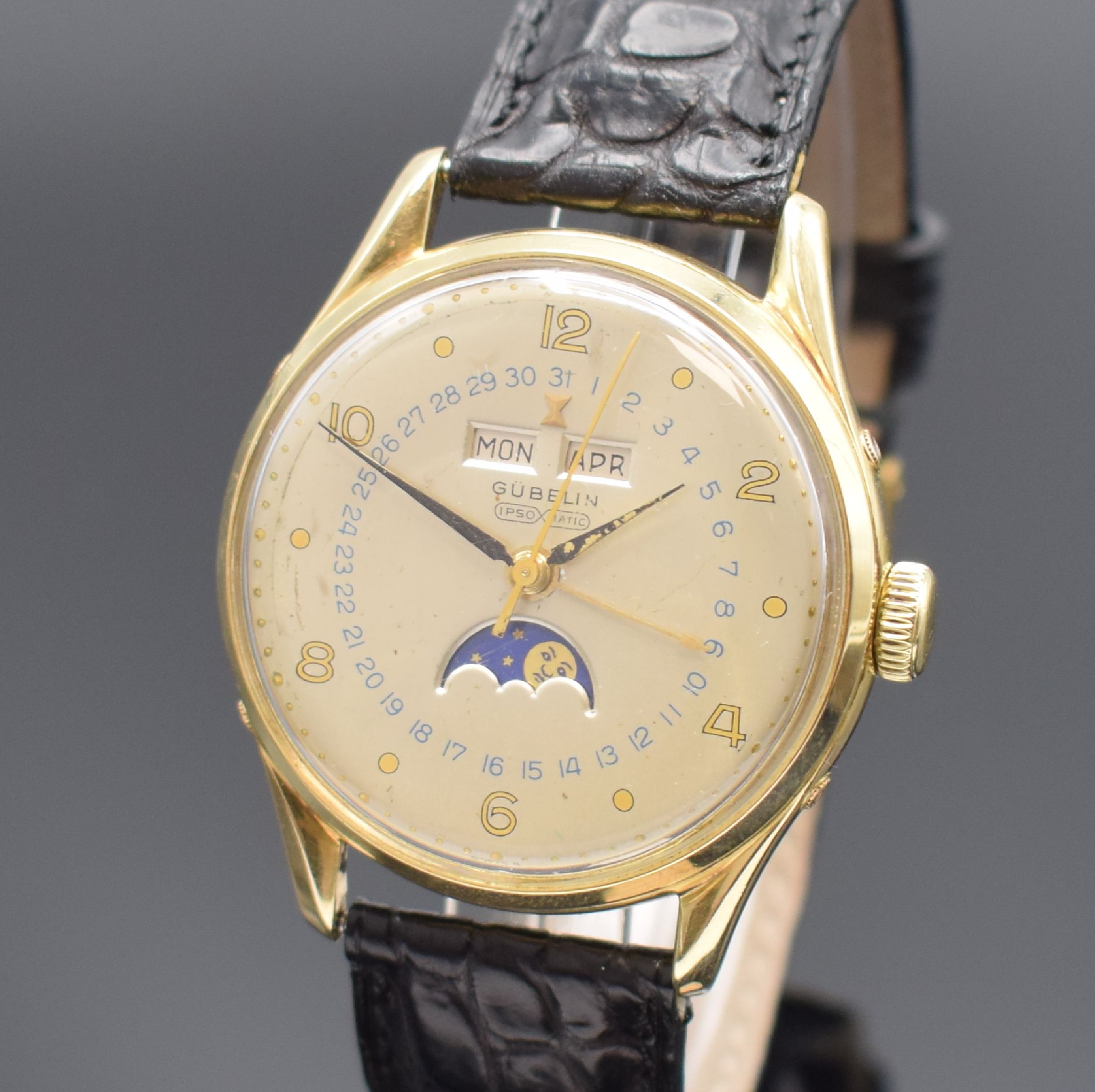 Detail a: GÜBELIN Ipso-Matic Herrenarmbanduhr mit Vollkalender, Schweiz um 1950, Automatik, verg. Geh., Boden und Lünette aufgedr., Korrekturdr. seitl. im ...