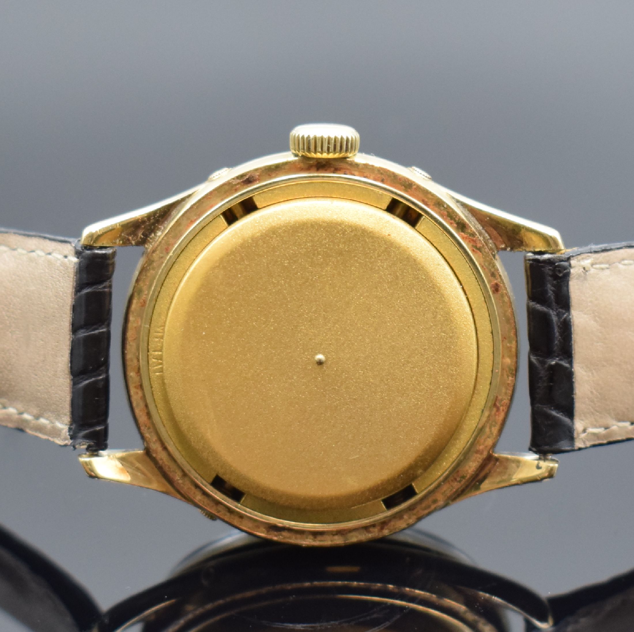 Detail e: GÜBELIN Ipso-Matic Herrenarmbanduhr mit Vollkalender, Schweiz um 1950, Automatik, verg. Geh., Boden und Lünette aufgedr., Korrekturdr. seitl. im ...