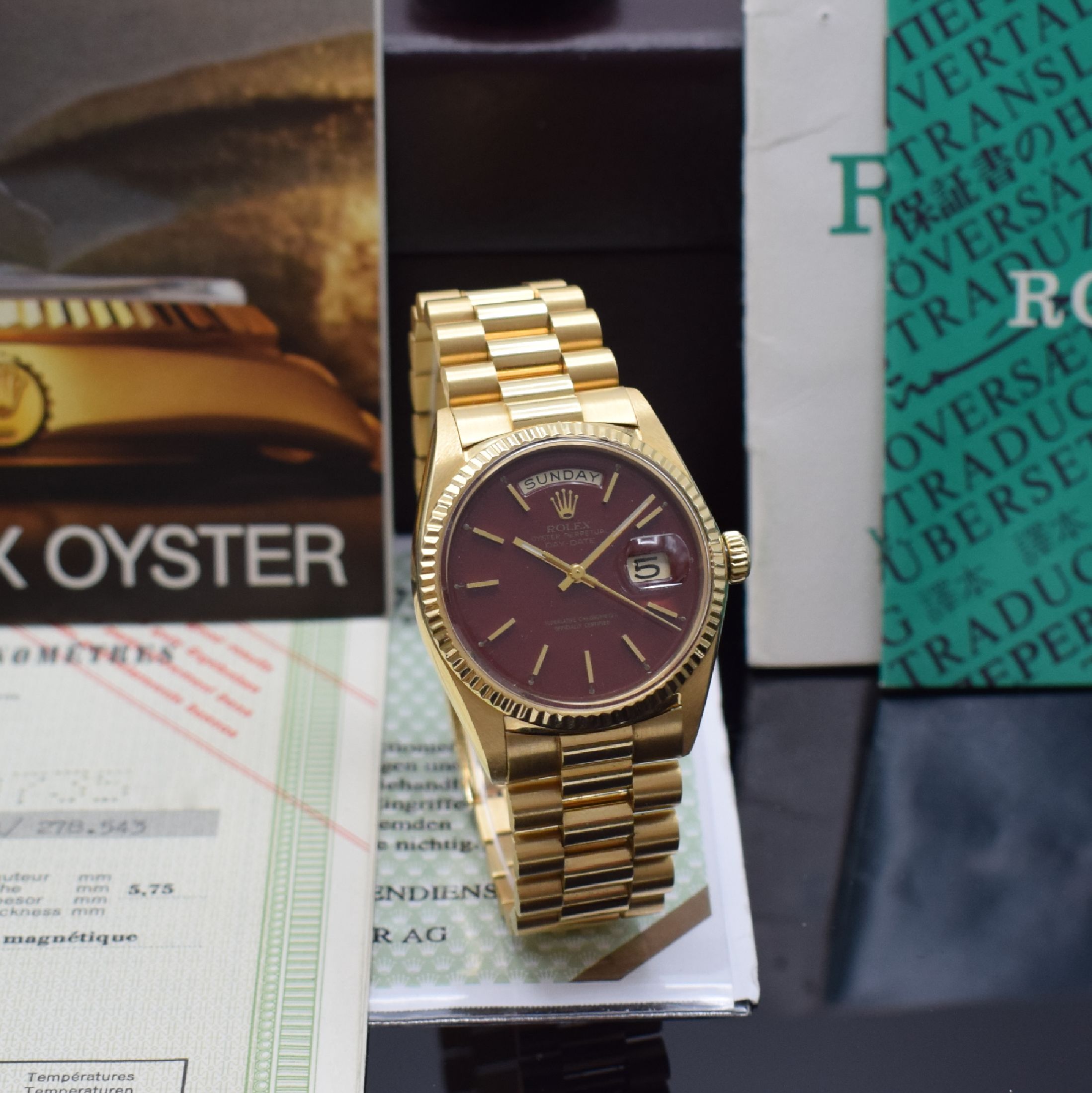 Detail b: ROLEX feine und extrem seltene Herrenarmbanduhr Day-Date mit Stella Burgundy- / Oxblood-Zifferblatt in GG 750/000 inklusive original Papieren ...