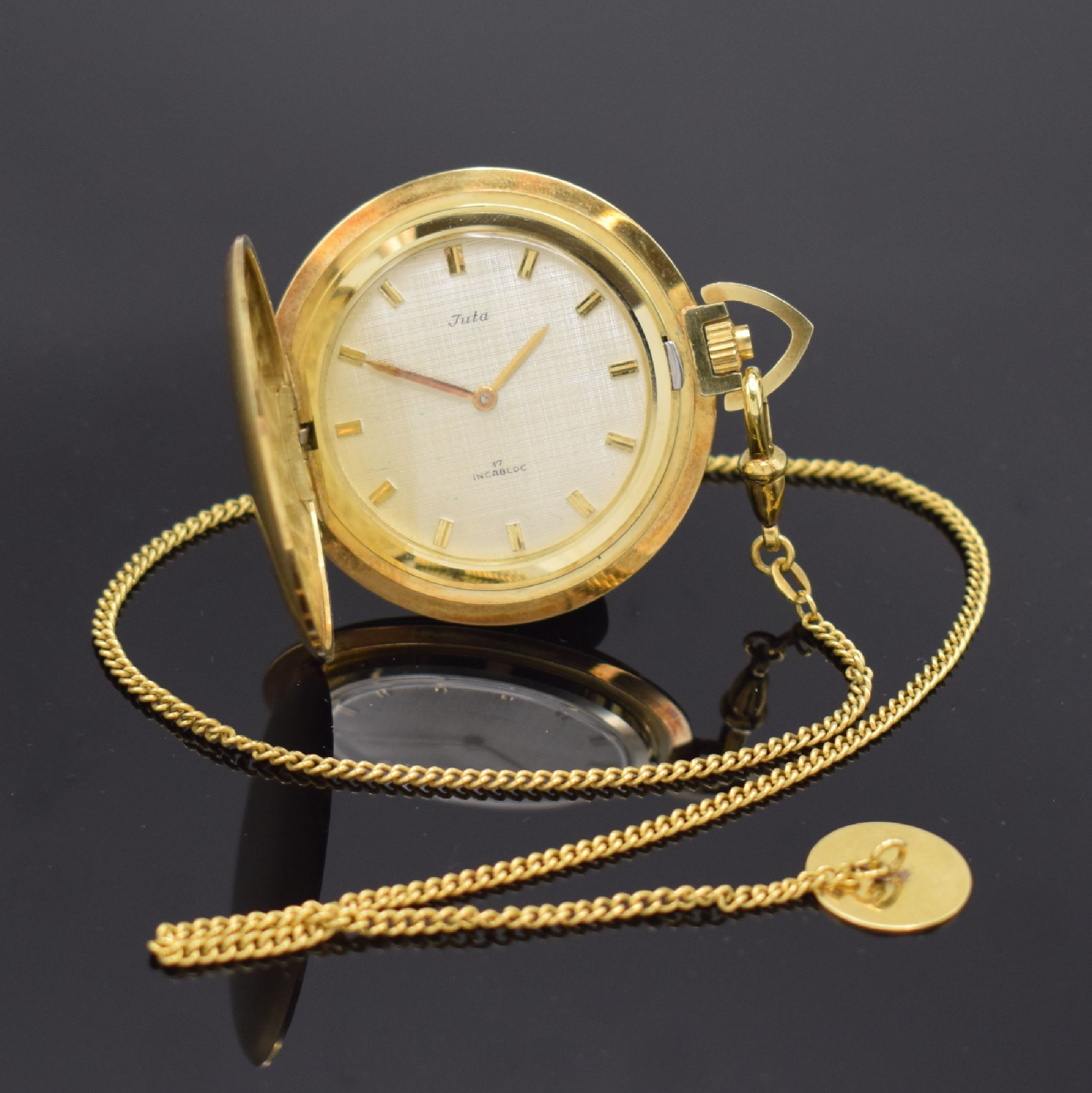 JUTA Savonette Frackuhr in GG 585/000 an GG 585/000 Kette, Deutschland um 1965, Handaufzug, Boden aufgedr., silb. Strukturzifferbl. m. aufges. ...