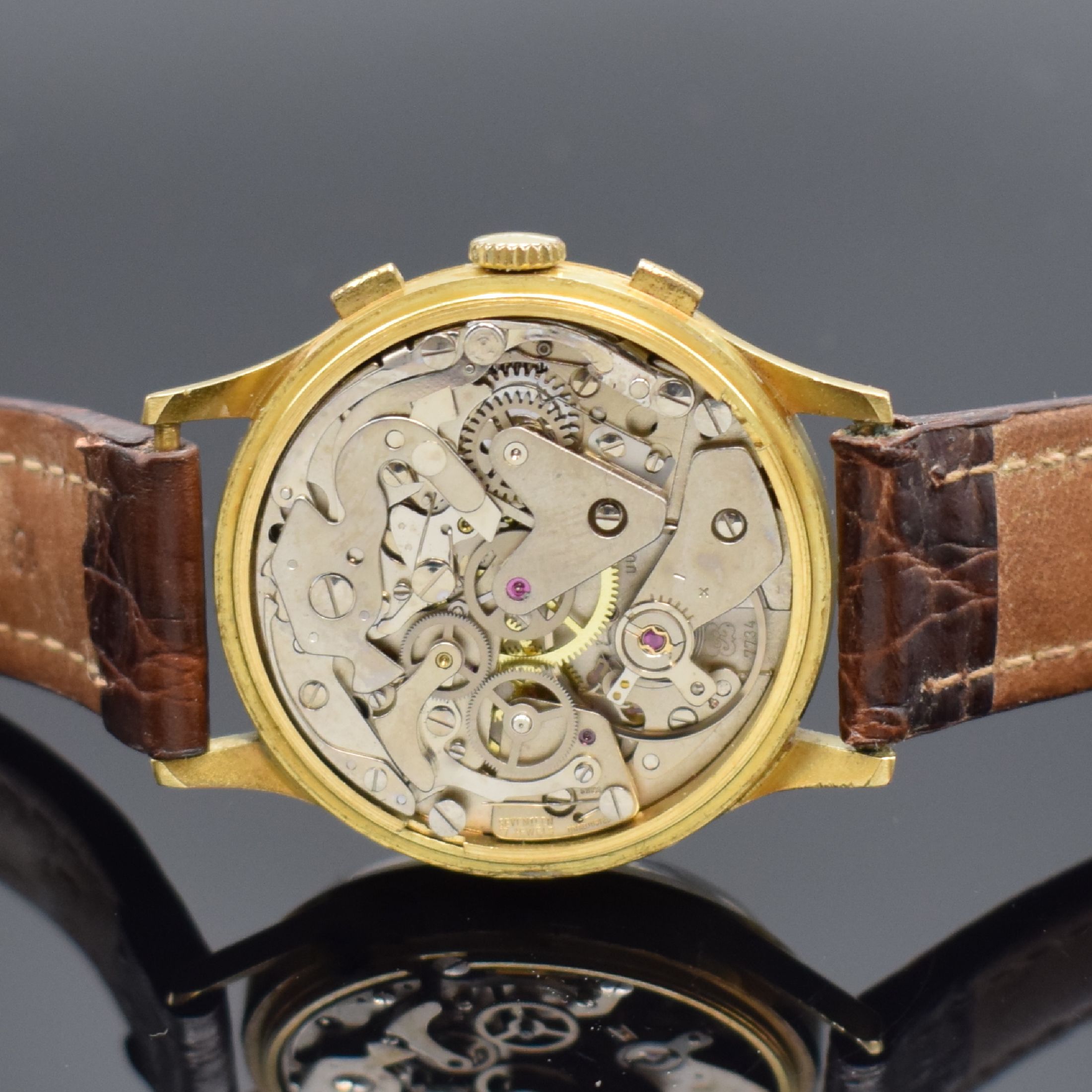 Detail e: CHRONOSWISS Herrenarmbanduhr mit Chronograph, Mondphase und Datum in GG 750/000, Schweiz um 1980, Handaufzug, 3-teil. Geh. dell., Boden und Glasrand ...