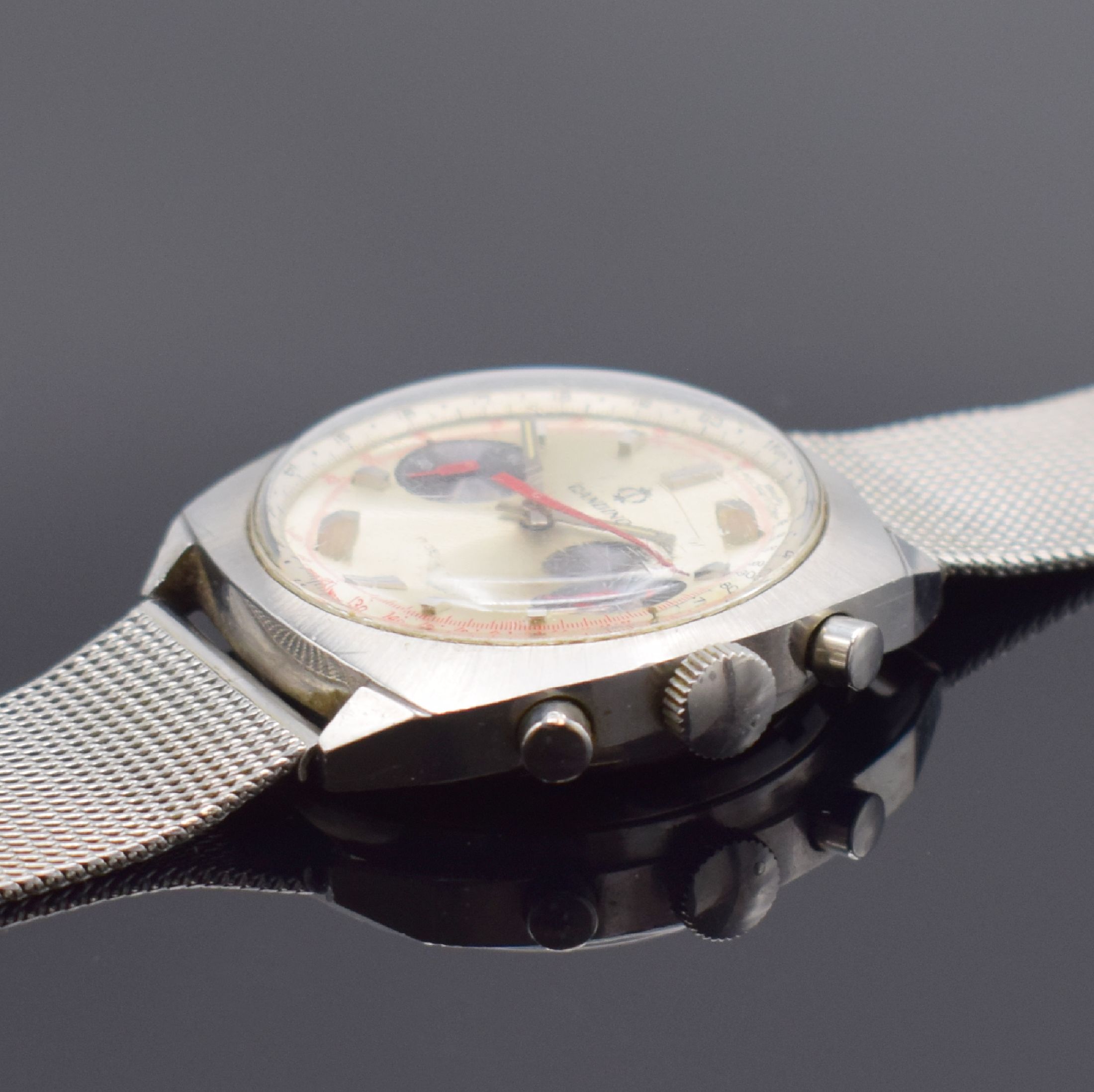 Detail b: CANDINO Herrenarmbanduhr mit Chronograph, Schweiz um 1965, Handaufzug, Edelstahlgeh. inkl. neutr. Stahlband, Boden verschr., silb. Zifferbl. m. ...