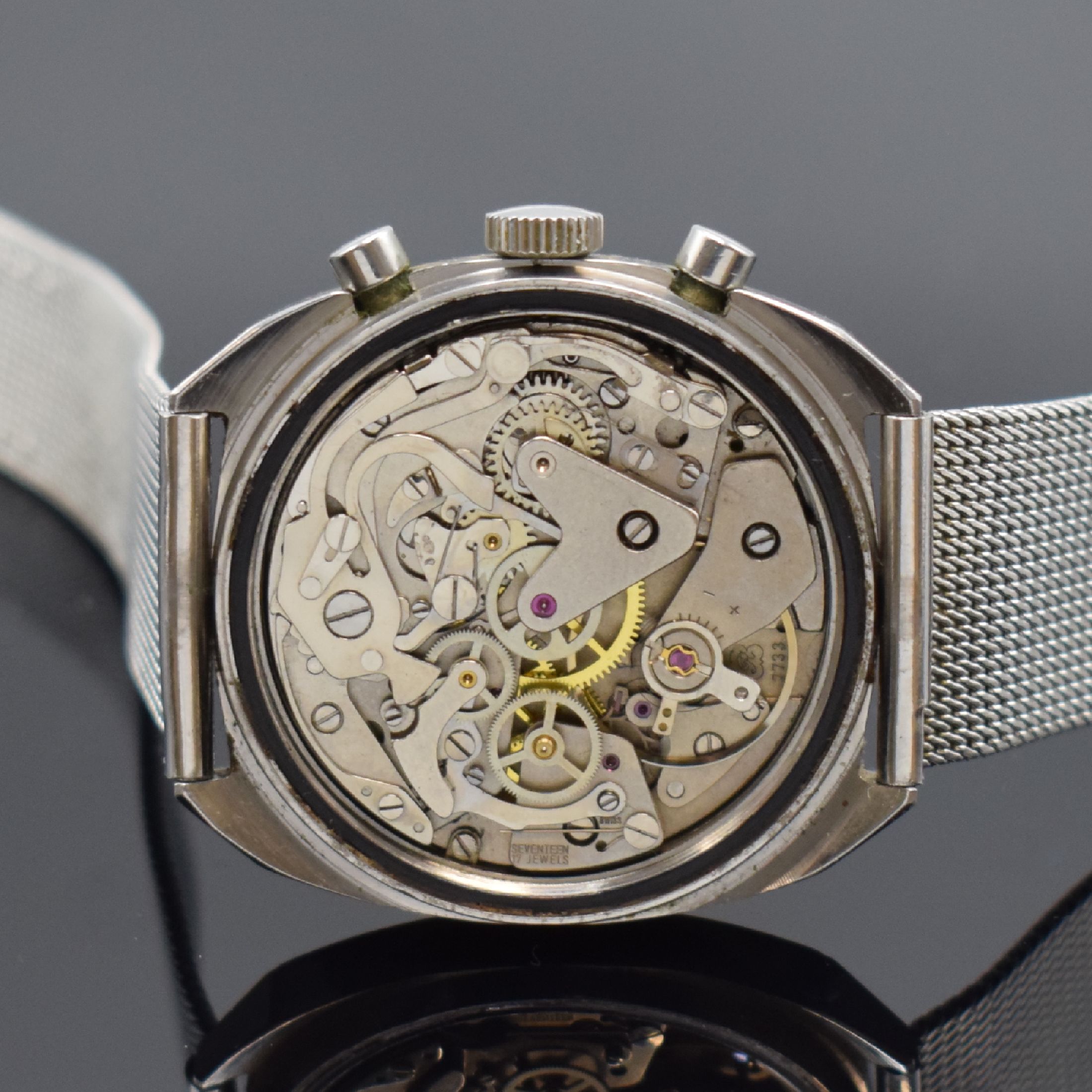 Detail d: CANDINO Herrenarmbanduhr mit Chronograph, Schweiz um 1965, Handaufzug, Edelstahlgeh. inkl. neutr. Stahlband, Boden verschr., silb. Zifferbl. m. ...