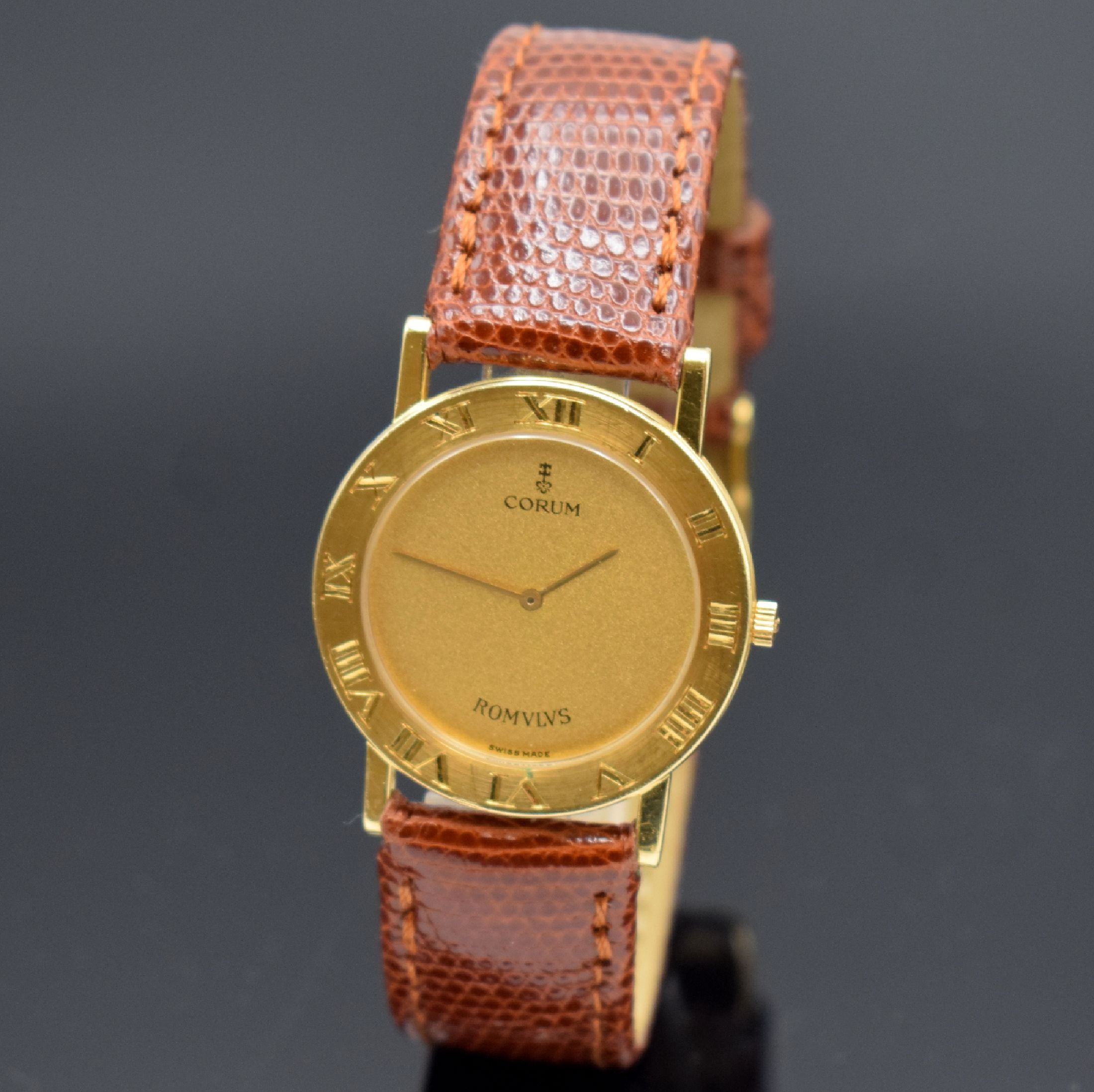 CORUM Romulus Armbanduhr in GG 750/000 Referenz 50.101.56, Schweiz um 1994, quarz, 2-teil. Geh., Boden 6-fach verschr. (1x Schr. def. / zu ers.), ...