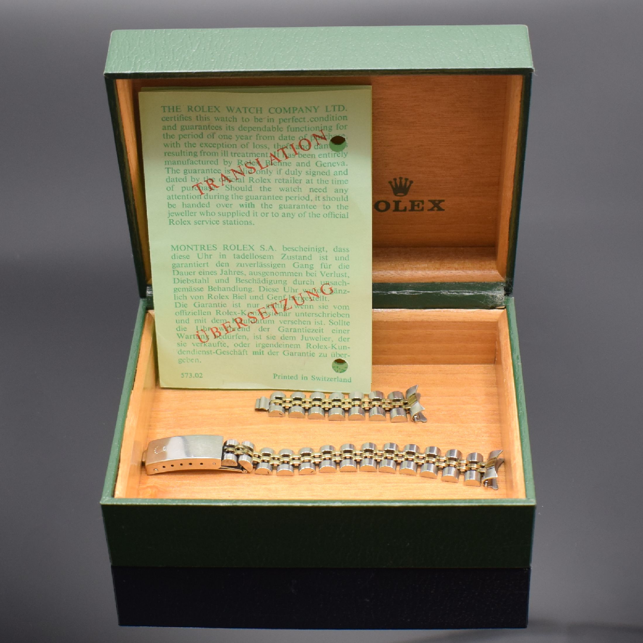 ROLEX Band für Damenarmbanduhr, Box und Übersetzung, Schweiz, 1) Band Ref. 62523-D14 in Stahl/Gold, an d. Schließe def., zu rep. o. als ...