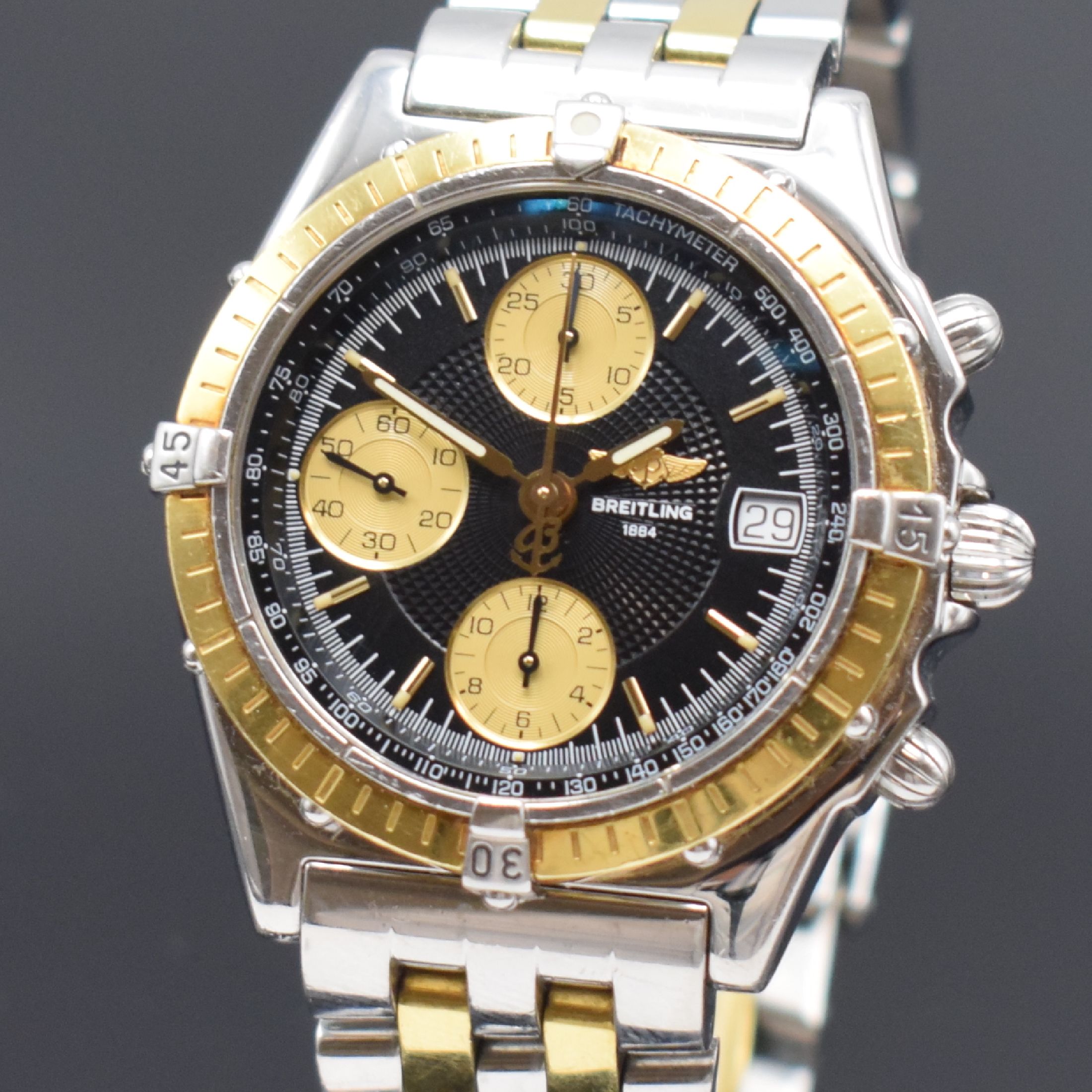 Detail a: BREITLING Chronomat Herrenarmbanduhr mit Chronograph Referenz D13050.1, Schweiz um 1995, Automatik, Edelstahl/Gold komb., verschr. Geh., Pilotband m. ...