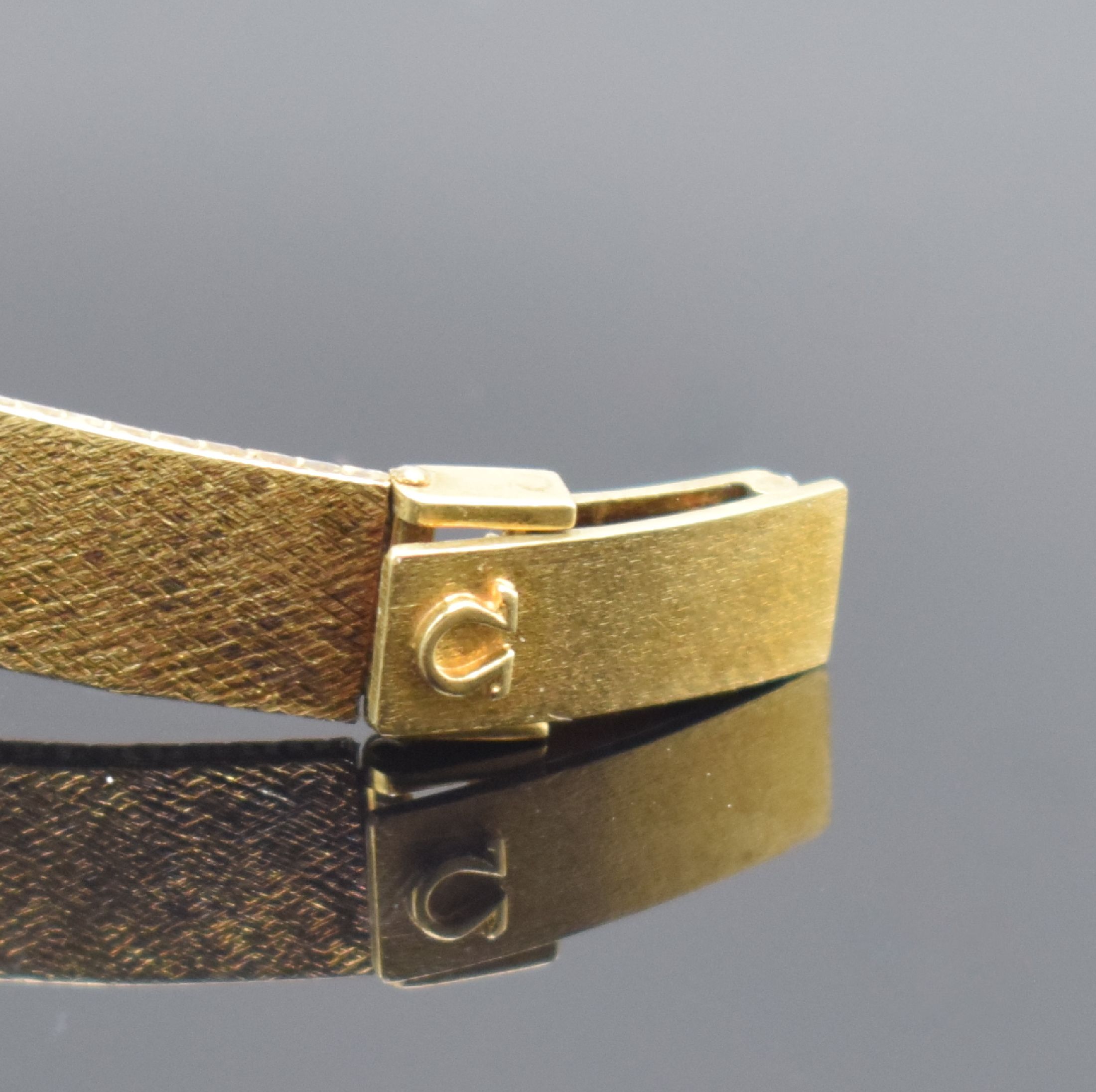 Detail b: OMEGA Damenarmbanduhr in GG 585/000, Schweiz um 1973, Automatik, Boden aufgedr., champagnerfarb. Zifferbl. m. aufgel. Std.- Ind., schwarze Zeiger, ...