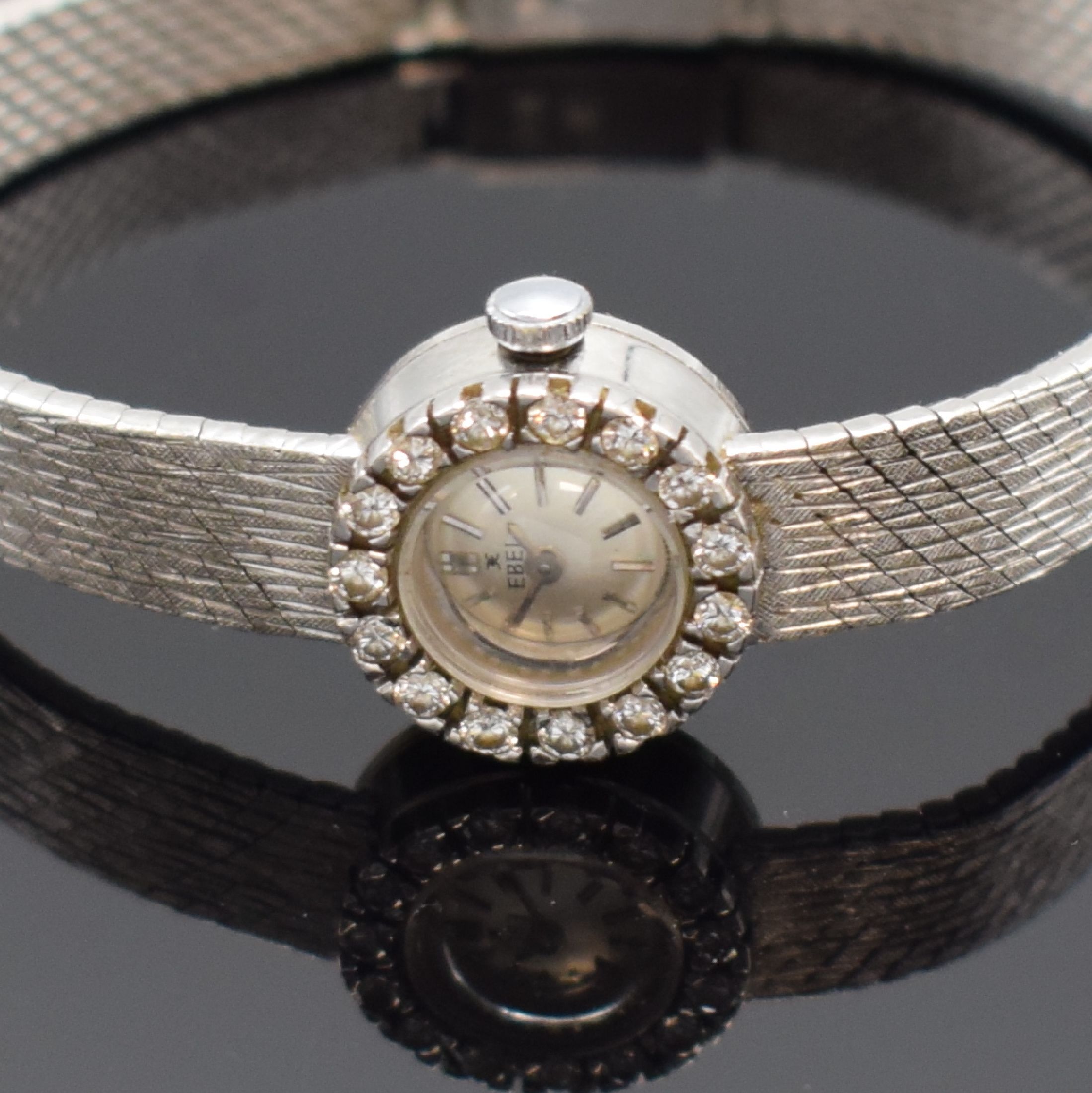 Detail a: EBEL Damenarmbanduhr in WG 750/000 mit Diamanten, Schweiz um 1960, Handaufzug, Boden aufgedr., Lünette aufw. m. Diamanten bes., silb. Zifferbl. m. ...