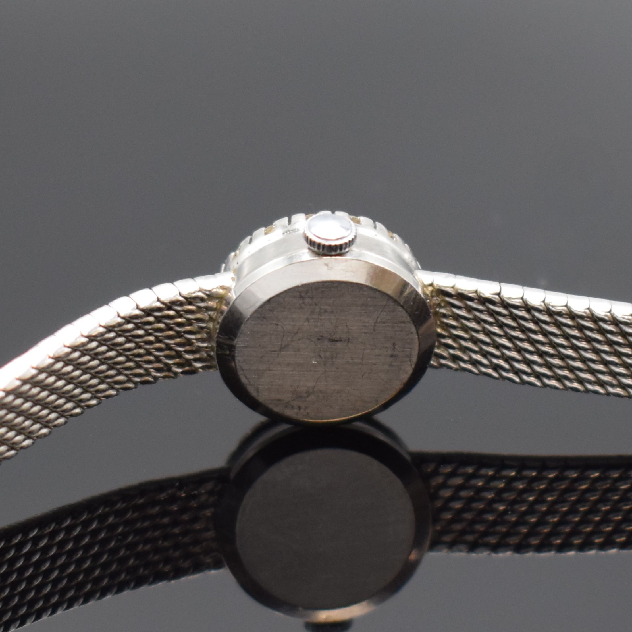 Detail c: EBEL Damenarmbanduhr in WG 750/000 mit Diamanten, Schweiz um 1960, Handaufzug, Boden aufgedr., Lünette aufw. m. Diamanten bes., silb. Zifferbl. m. ...