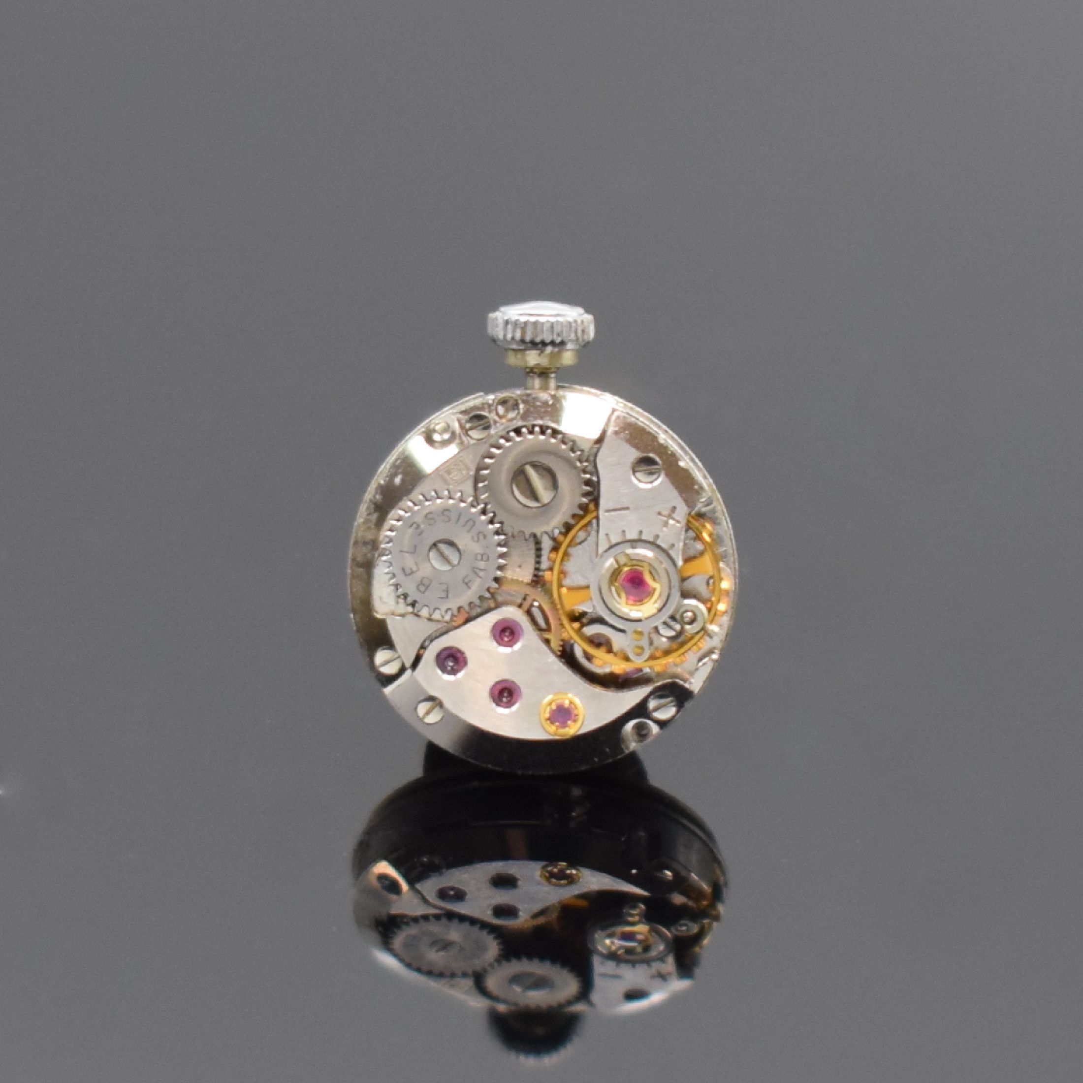 Detail e: EBEL Damenarmbanduhr in WG 750/000 mit Diamanten, Schweiz um 1960, Handaufzug, Boden aufgedr., Lünette aufw. m. Diamanten bes., silb. Zifferbl. m. ...
