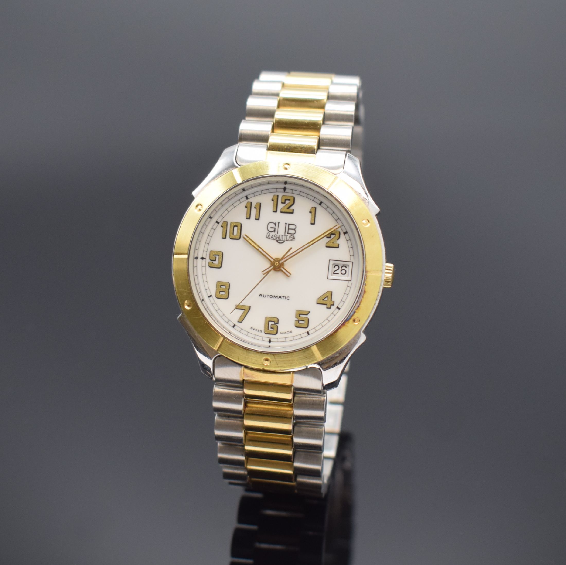 GUB Glashütte/SA Herrenarmbanduhr, Deutschland um 1990, Automatik, beids. vergl. z. T. verg./verchr., Gliederband m. Faltschl.,Boden aufgedr., ...