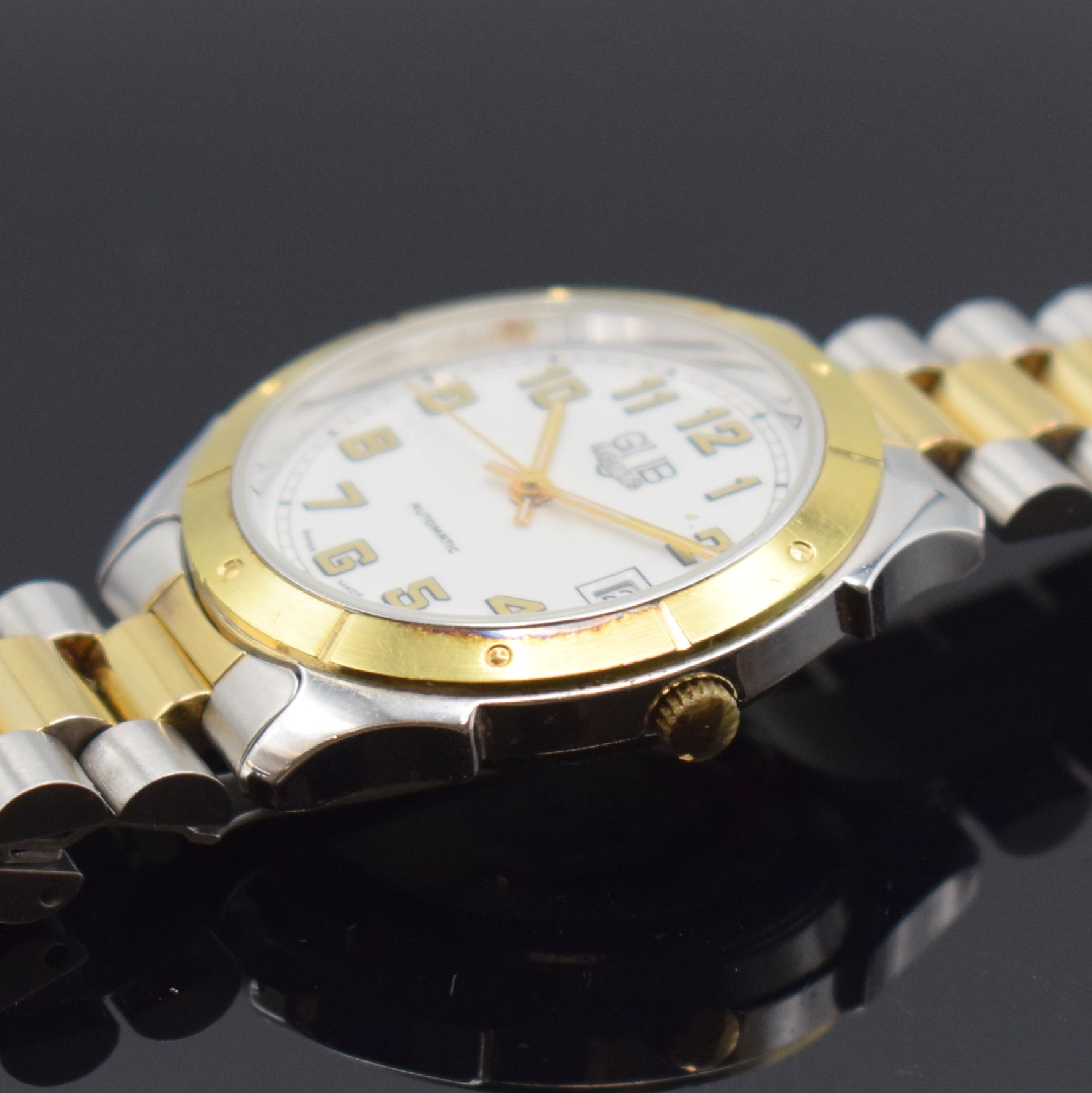 Detail c: GUB Glashütte/SA Herrenarmbanduhr, Deutschland um 1990, Automatik, beids. vergl. z. T. verg./verchr., Gliederband m. Faltschl.,Boden aufgedr., ...