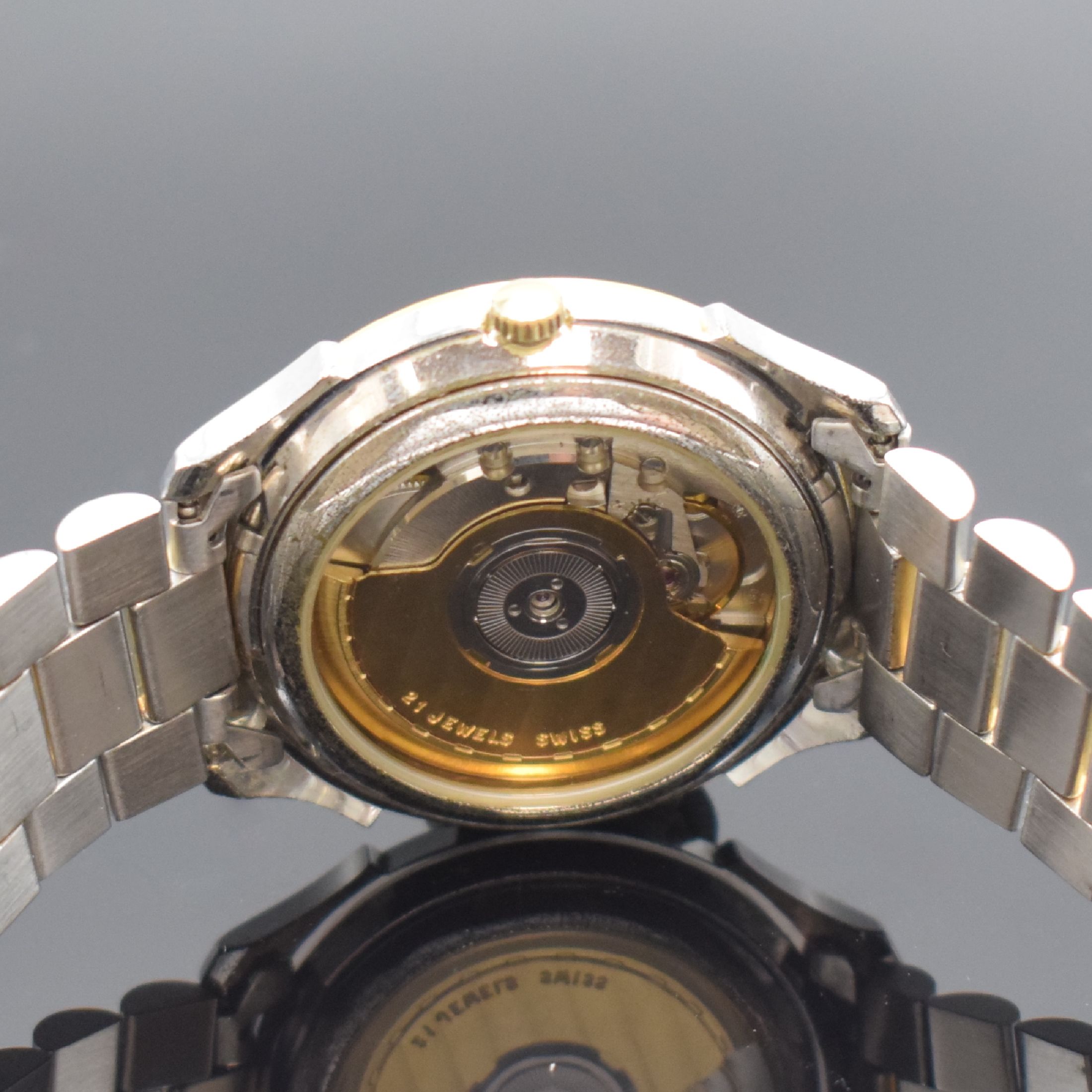 Detail d: GUB Glashütte/SA Herrenarmbanduhr, Deutschland um 1990, Automatik, beids. vergl. z. T. verg./verchr., Gliederband m. Faltschl.,Boden aufgedr., ...