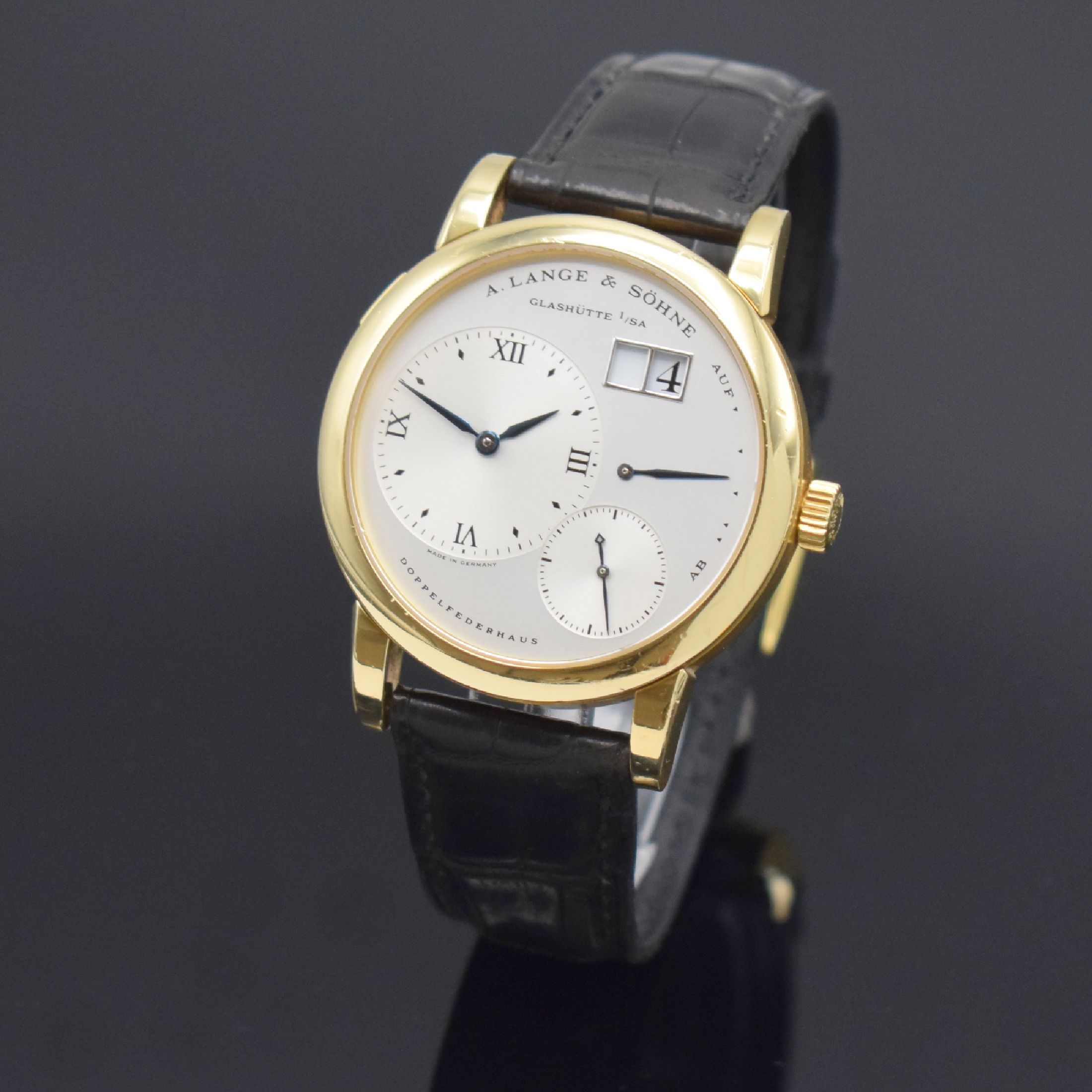 A. LANGE & SÖHNE hochfeine Herrenarmbanduhr Modell Lange 1 Referenz 101.021, Handaufzug, Deutschland um 1999, GG 750/000 inkl. orig. Lederband m. ...