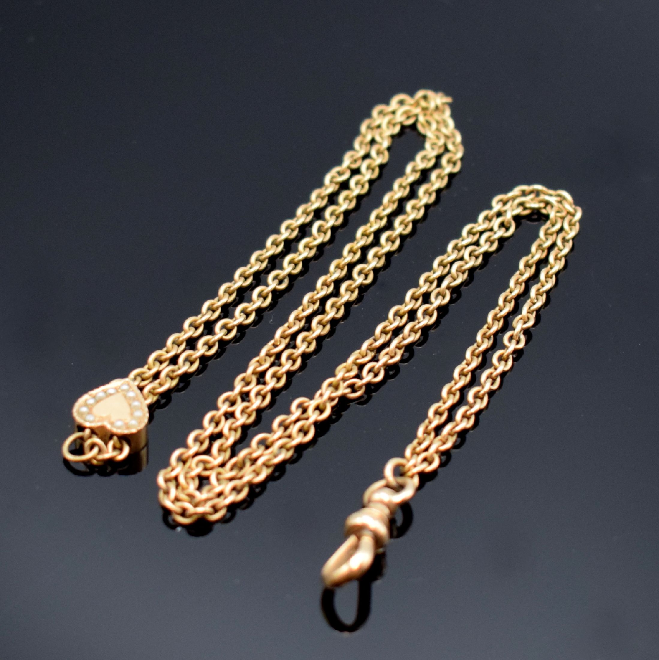 Taschenuhrkette in RoseG 585/000, mit Karabiner, L. ca. 35 cm, Gew. ca. 16g, Länge durch Kettenschieber in Form eines Herzens verstellbar, in ...