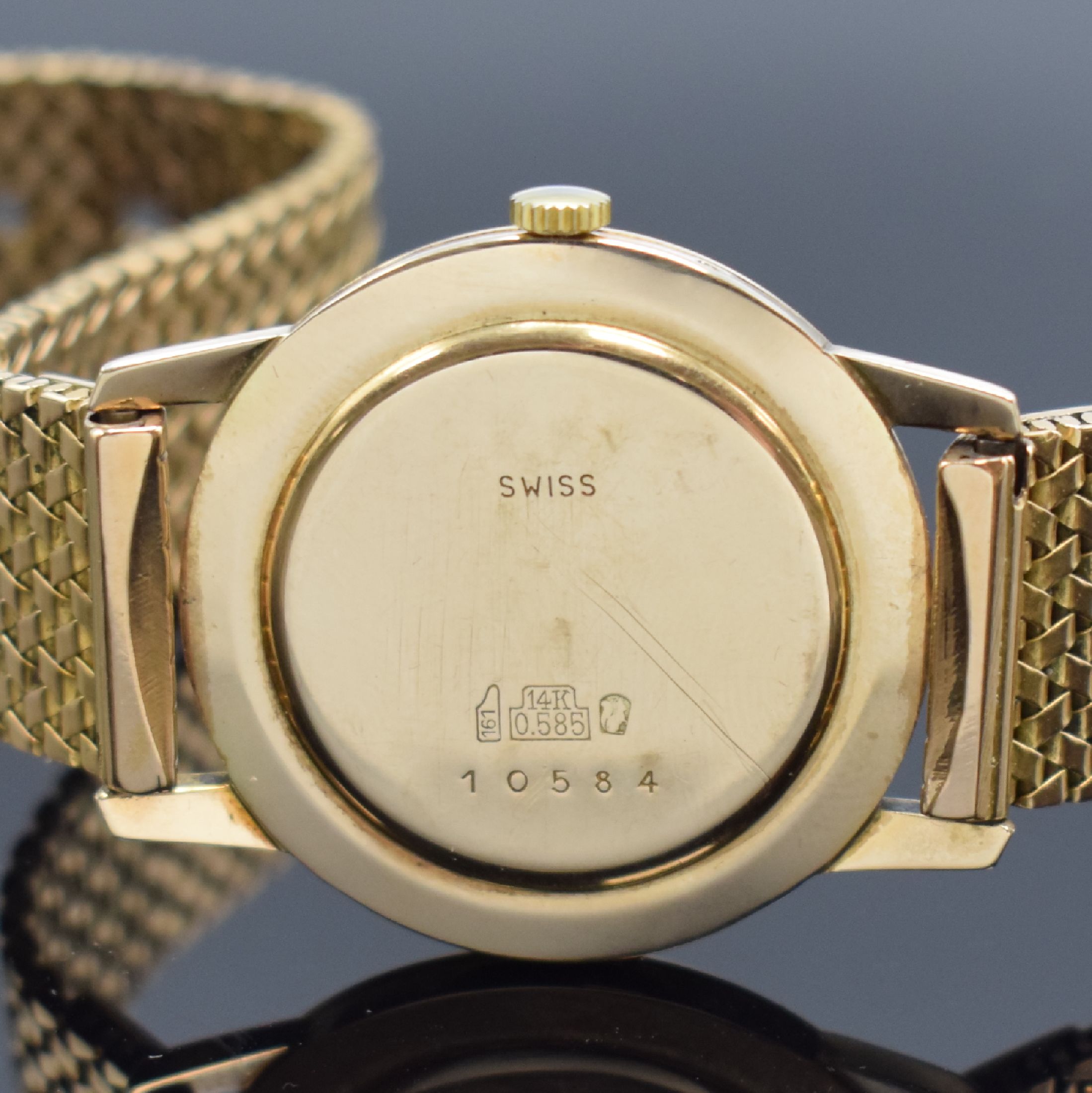 Detail e: RADO Herrenarmbanduhr in RG 585/000 an RG 750/000 Band, Handaufzug, Schweiz um 1960, einschaliges Geh., Glasrand aufgedr., silb. Zifferbl. m. aufgel. ...