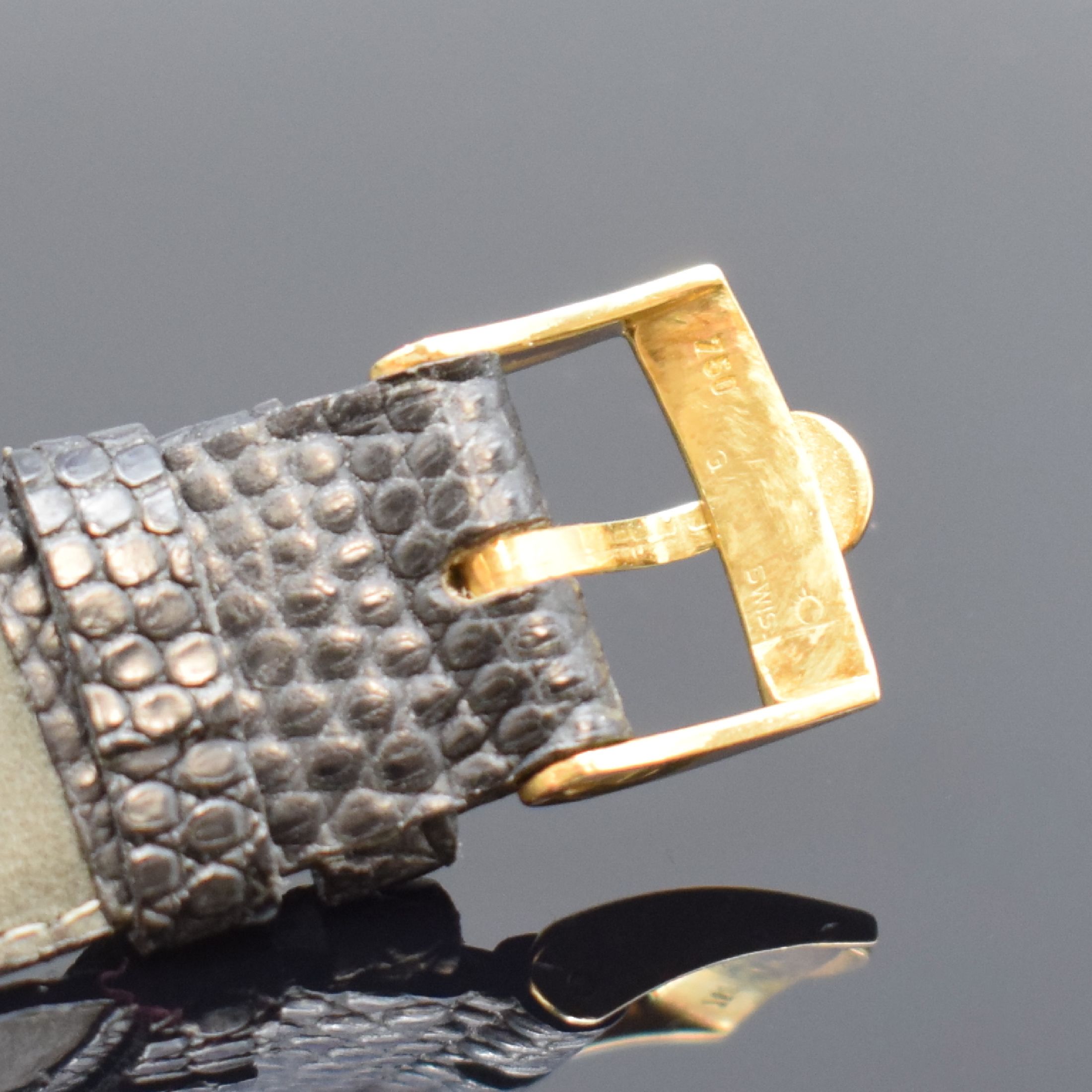 Detail d: OMEGA quadratische Herrenarmbanduhr mit Hammerautomatik in GG 750/000, Schweiz um 1950, Automatik, gedr. Geh., Boden dell., Lederband m. orig. Omega ...