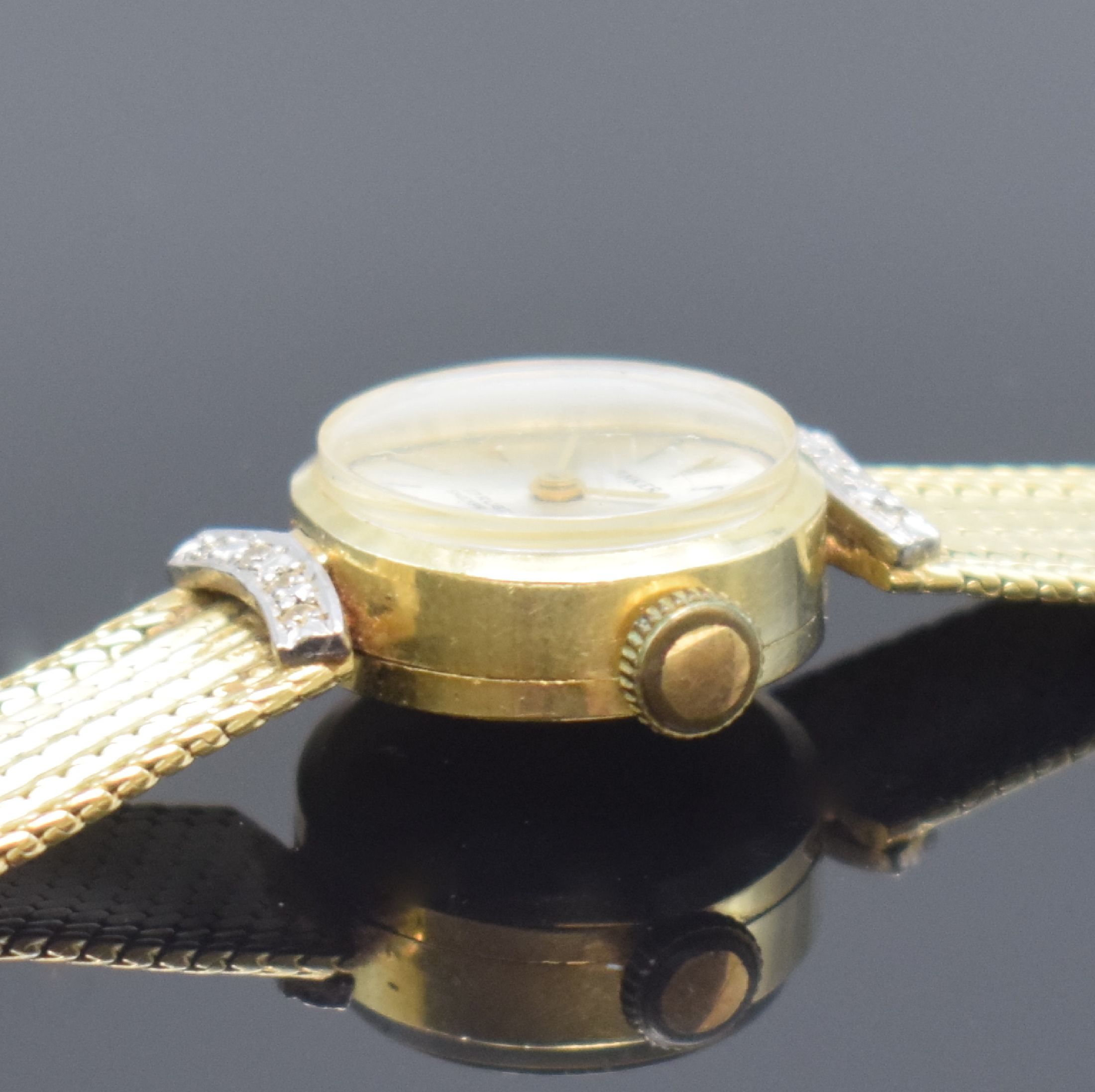 Detail d: ANKER Damenarmbanduhr in GG 585/000, Deutschland um 1960, Handaufzug, 2-teil. Geh., Boden aufgedr., Milanaiseband, silb. Zifferbl., gold. Zeiger, ...