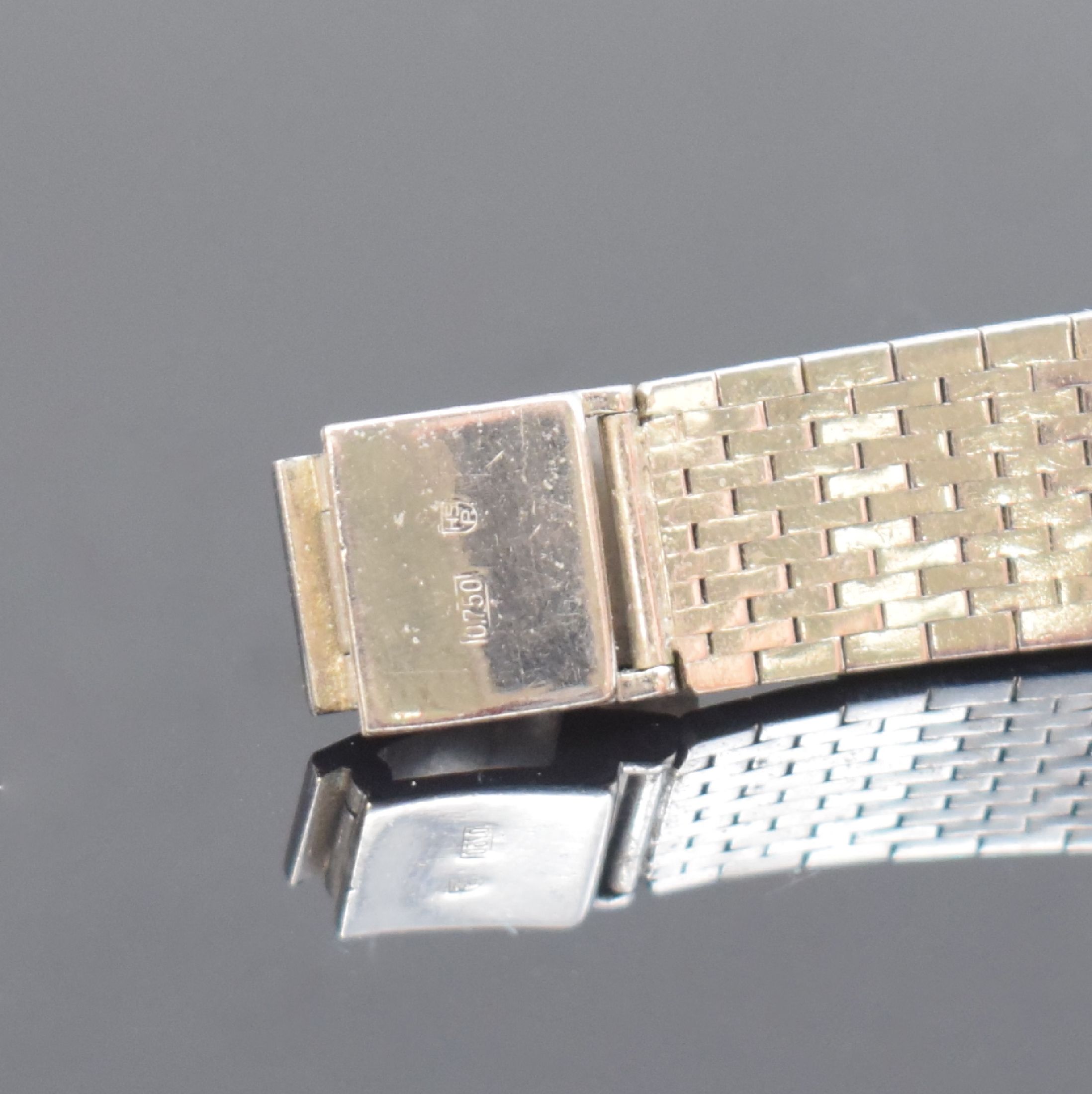 Detail b: Ausgefallene Damenarmbanduhr in WG 750/000 mit aufwendigem Diamantbesatz, Schweiz um 1970, Handaufzug, gedr. Geh., Milanaiseband, WG-Zifferbl. m. ...