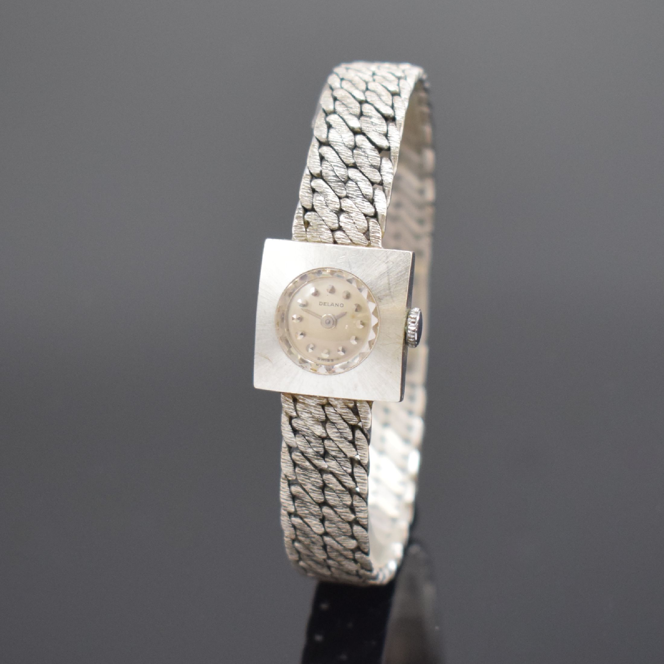 DELANO Damenarmbanduhr in WG 750/000, Schweiz um 1960, Handaufzug, gedr. Gehäuse, Kettenglieder-Band, silb. Zifferbl. m. aufges. Std.-Ind., silb. ...