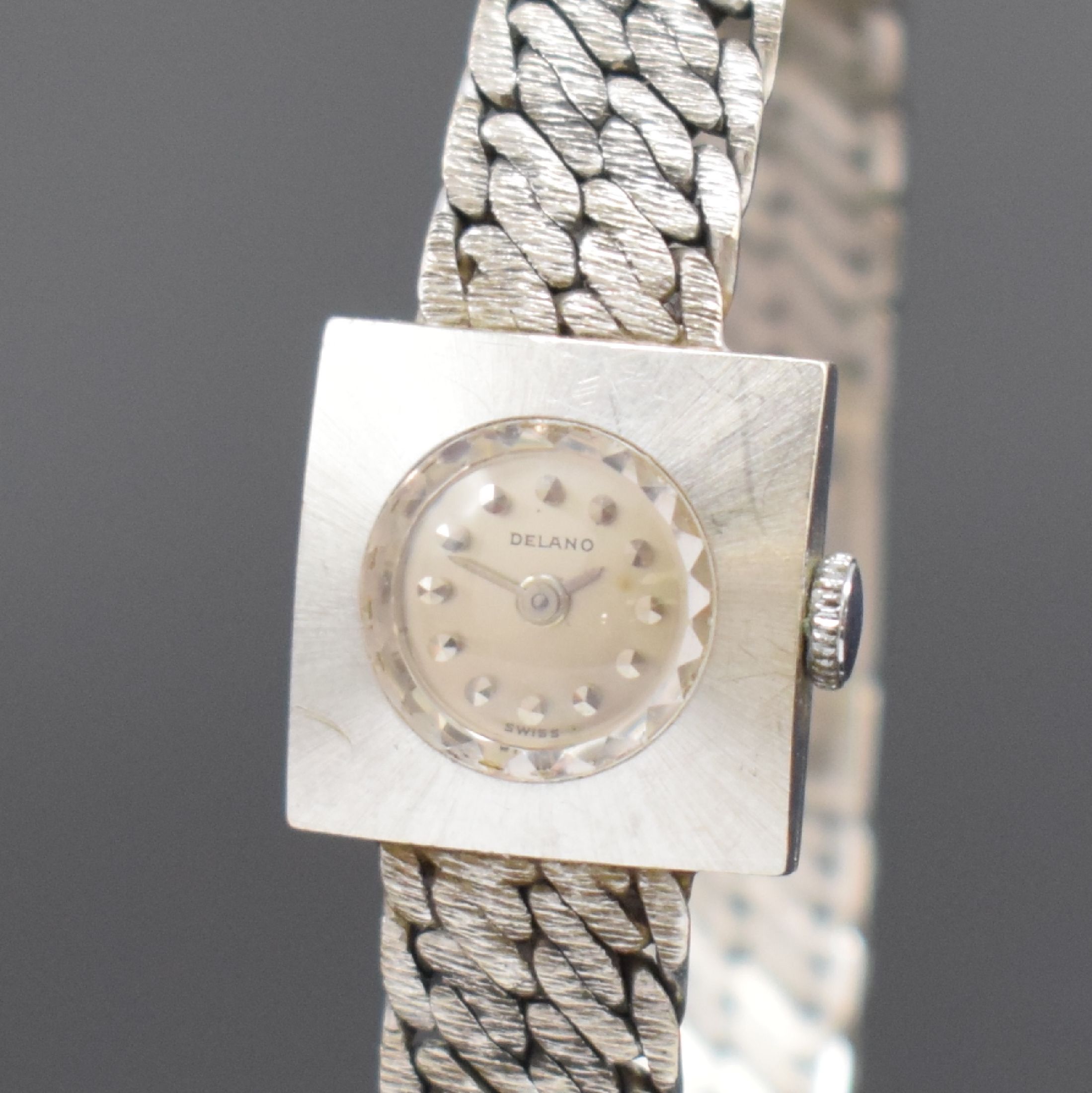 Detail a: DELANO Damenarmbanduhr in WG 750/000, Schweiz um 1960, Handaufzug, gedr. Gehäuse, Kettenglieder-Band, silb. Zifferbl. m. aufges. Std.-Ind., silb. ...
