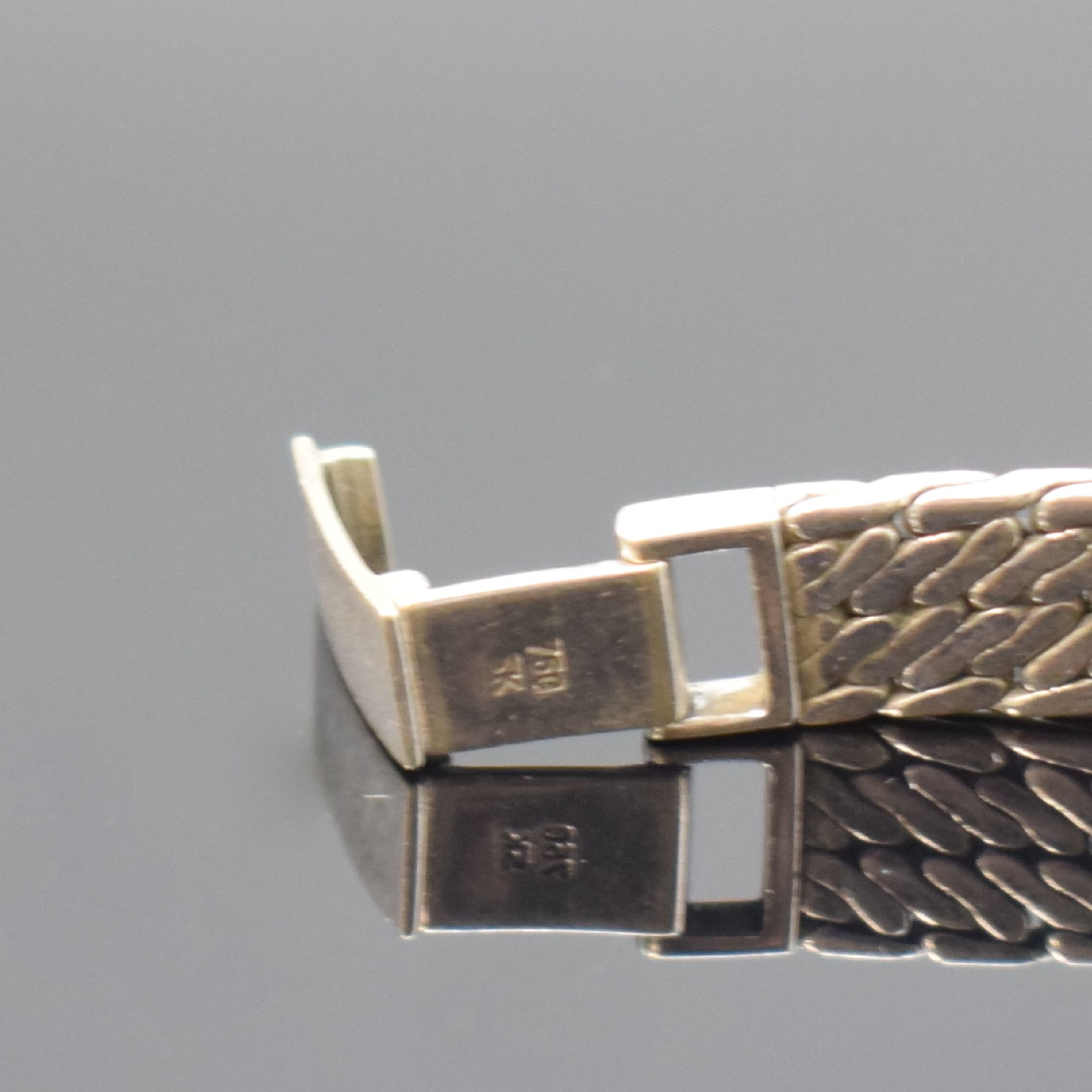 Detail b: DELANO Damenarmbanduhr in WG 750/000, Schweiz um 1960, Handaufzug, gedr. Gehäuse, Kettenglieder-Band, silb. Zifferbl. m. aufges. Std.-Ind., silb. ...
