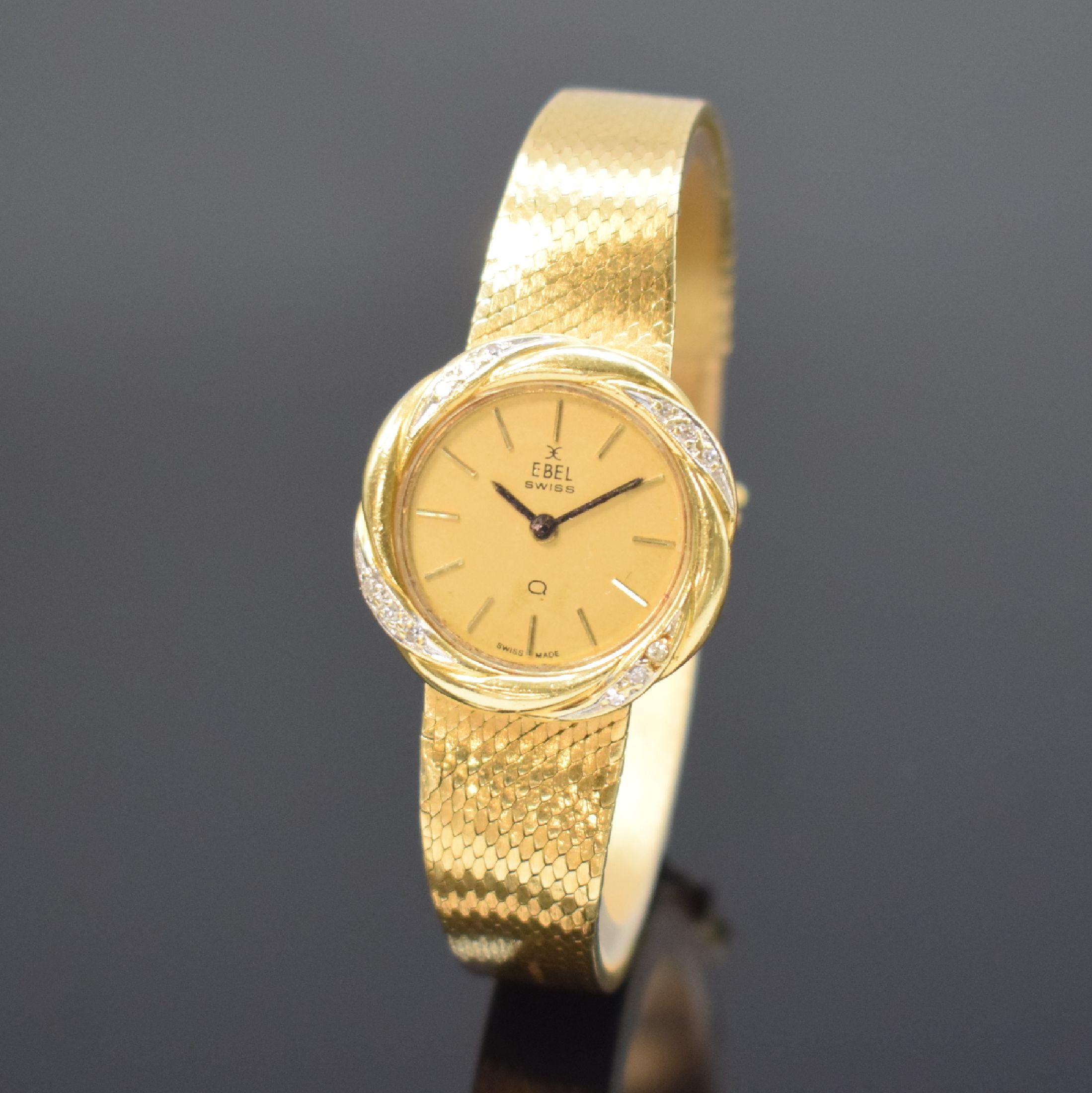 EBEL Damenarmbanduhr in GG 750/000, Schweiz um 1970, quarz, gedr. Gehäuse, Milanaiseband, gold. Zifferbl. m. aufges. Std.-Ind., D. ca. 24 mm, L. ca. ...