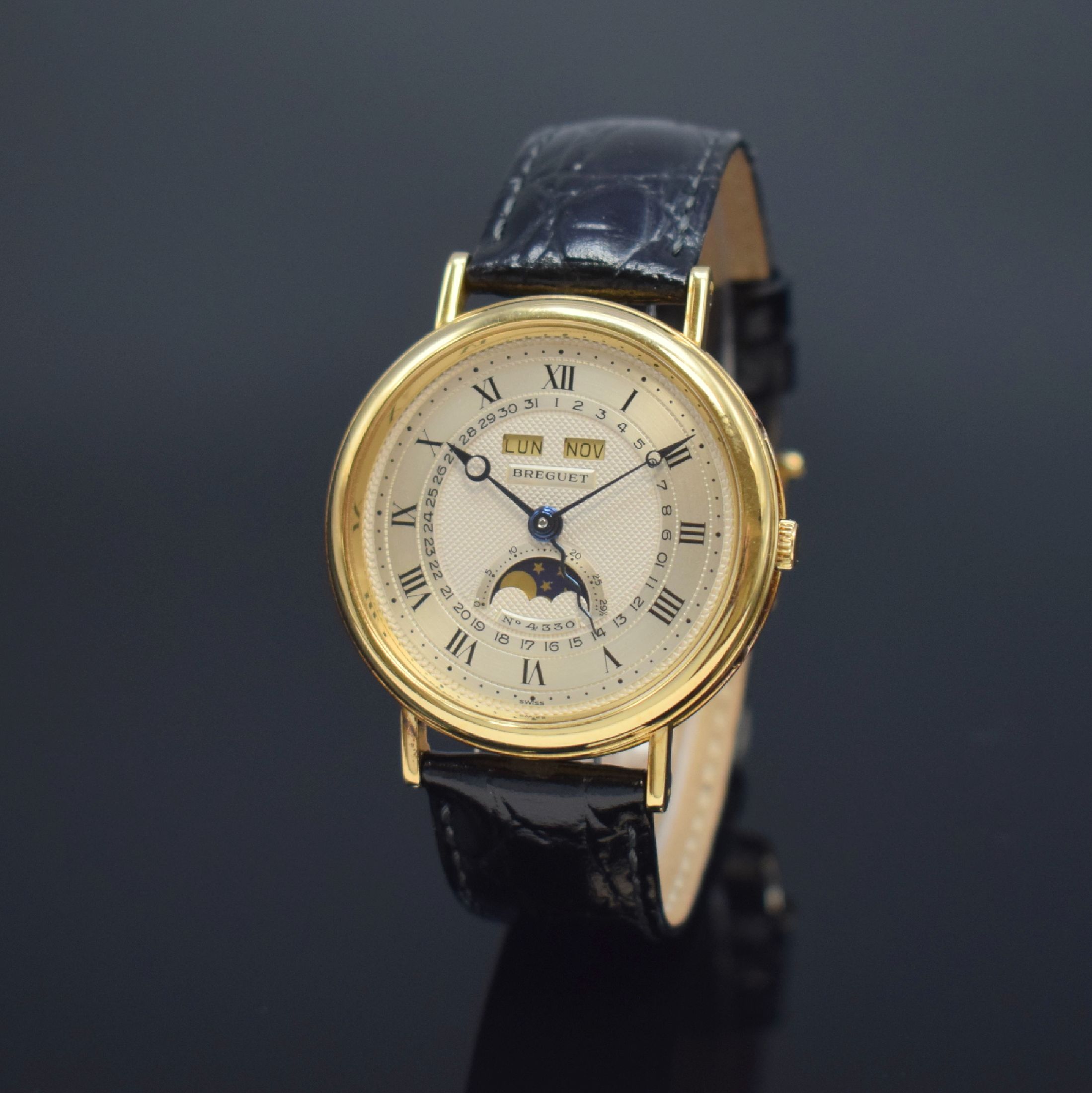 BREGUET Herrenarmbanduhr mit Vollkalender und Mondphase in GG 750/000, Schweiz um 1990, Automatik, gedr. Geh. m. geripptem Rand, seitl. Korrekturdr. ...