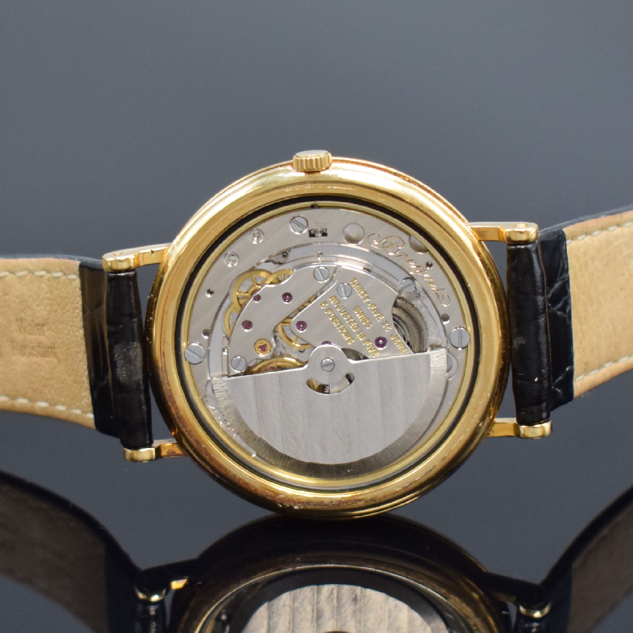 Detail f: BREGUET Herrenarmbanduhr mit Vollkalender und Mondphase in GG 750/000, Schweiz um 1990, Automatik, gedr. Geh. m. geripptem Rand, seitl. Korrekturdr. ...