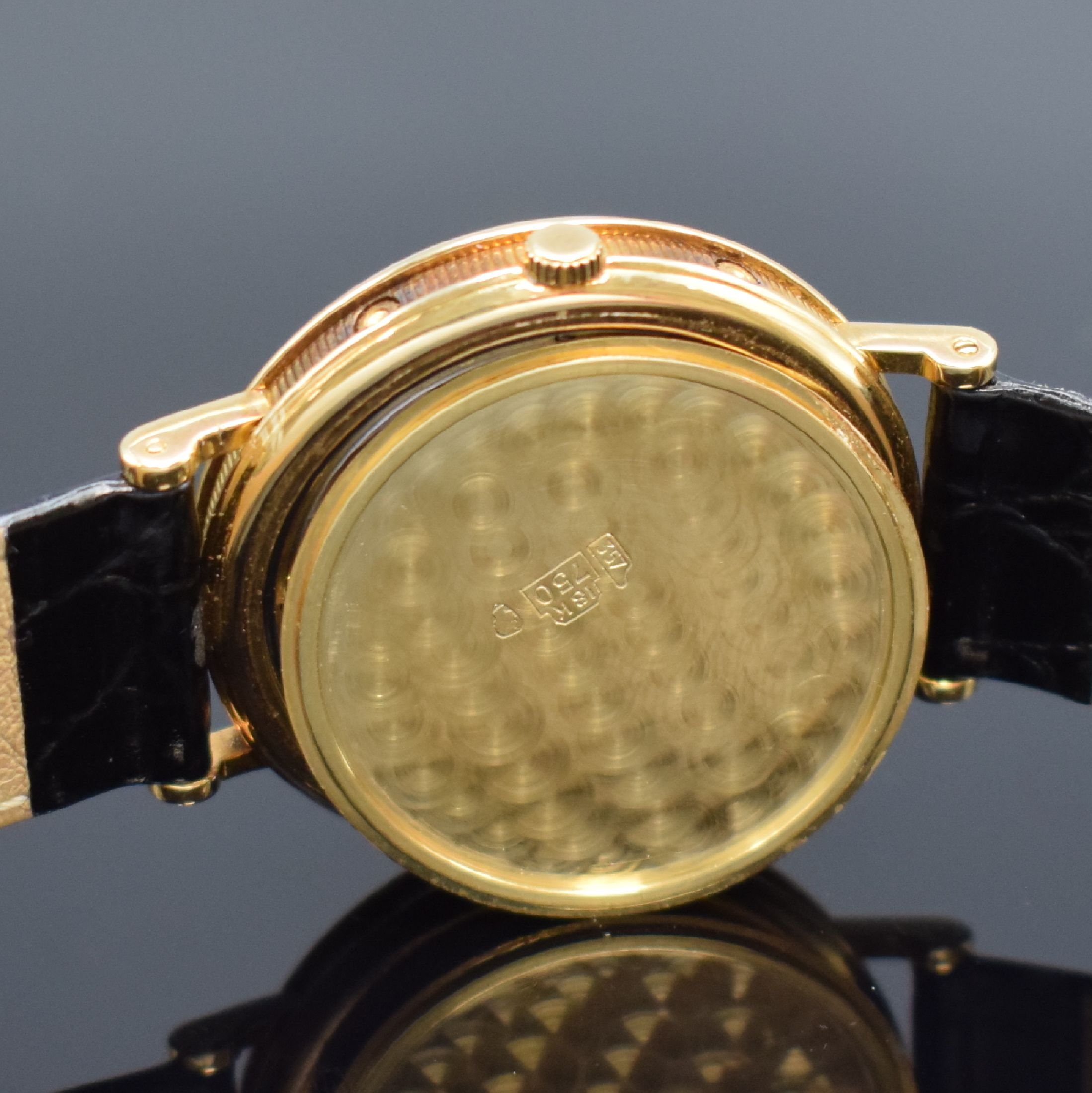 Detail h: BREGUET Herrenarmbanduhr mit Vollkalender und Mondphase in GG 750/000, Schweiz um 1990, Automatik, gedr. Geh. m. geripptem Rand, seitl. Korrekturdr. ...