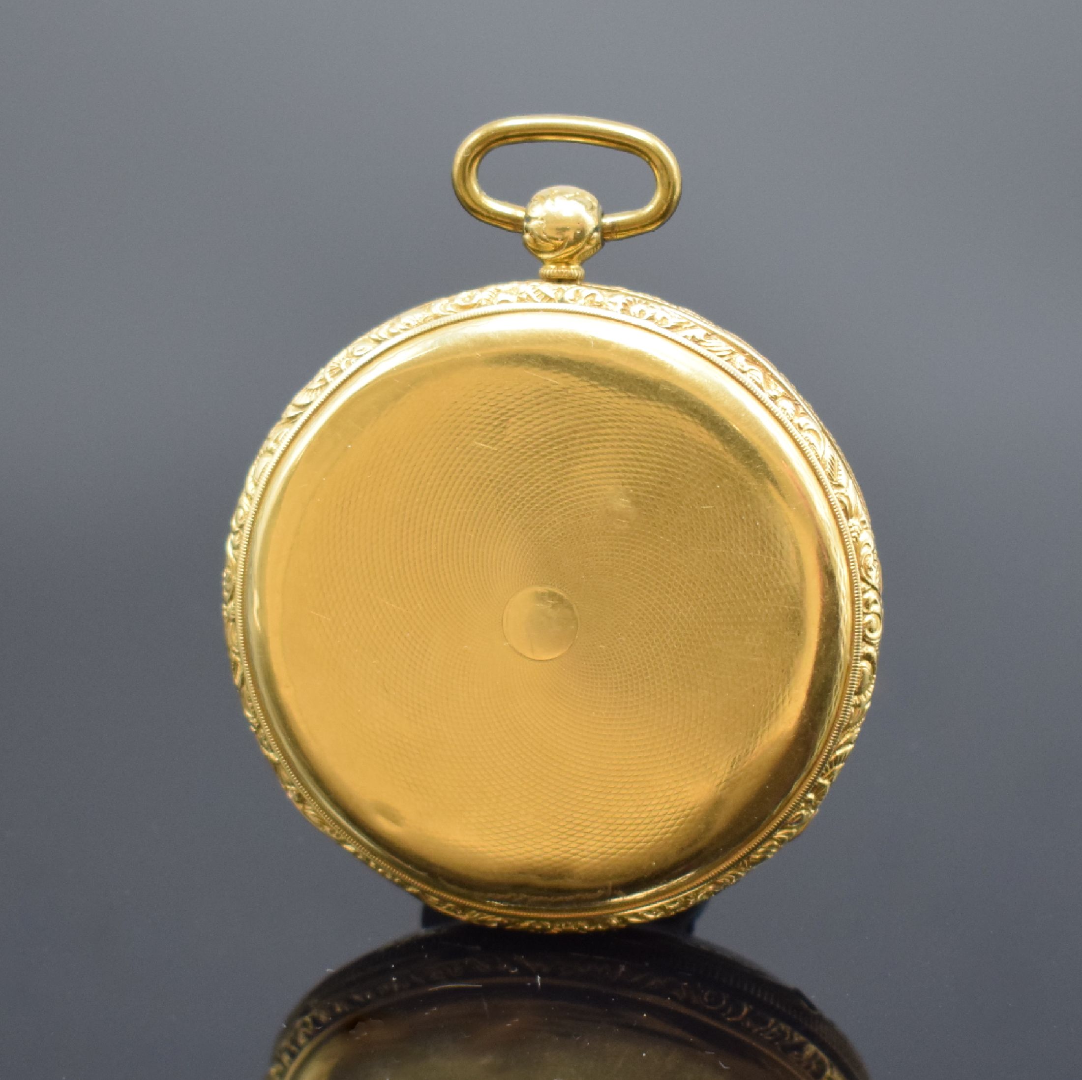 Detail a: Offene Taschenuhr in GG 750/000, Schweiz um 1870, grav. Geh. m. Münzrand, guill. Rückdeckel dell., Goldcuvette floral grav., Emailzifferbl. ...