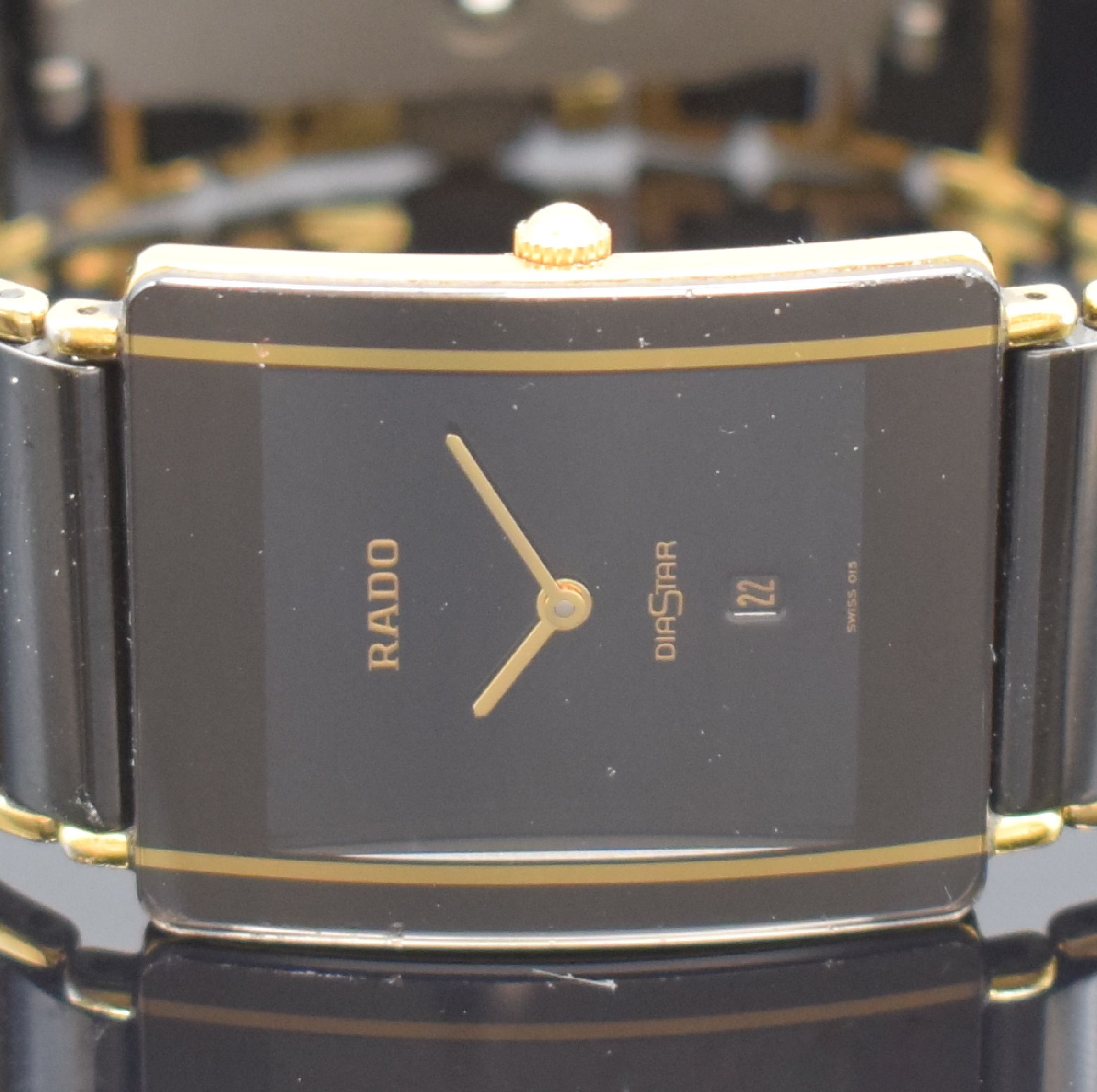 Detail a: RADO Diastar Herrenarmbanduhr Referenz 160.0282.3, Schweiz um 1995, quarz, Geh. in Stahl teils verg., Keramik-Gliederband m. dopp. Faltschl. (zu ...