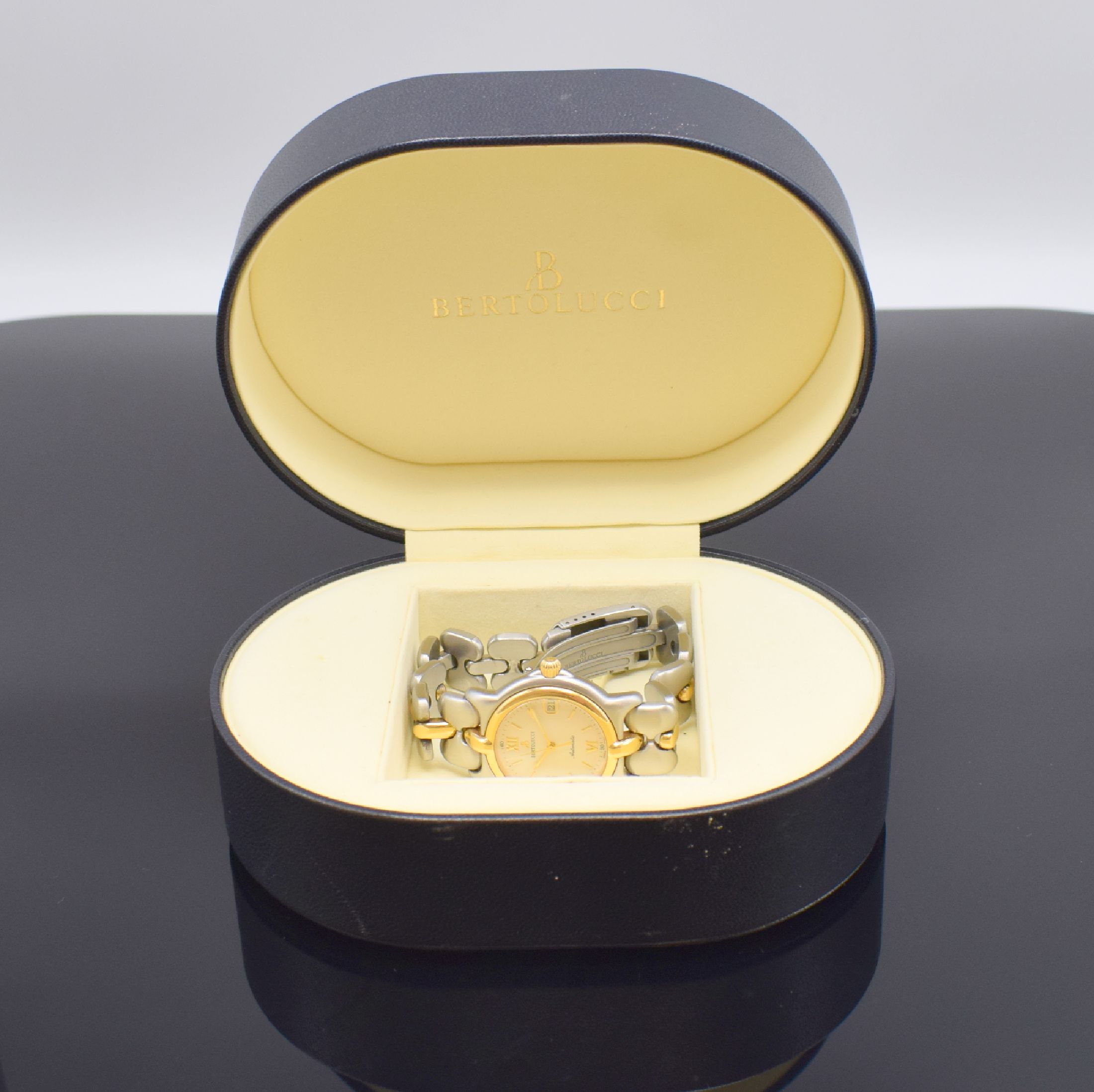 Detail e: BERTOLUCCI Herrenarmbanduhr Serie Pulchra Referenz 124 49 B, Schweiz um 1995, Automatik, Edelstahl/Gold kombiniert inkl. Gliederband m. Faltschl., ...