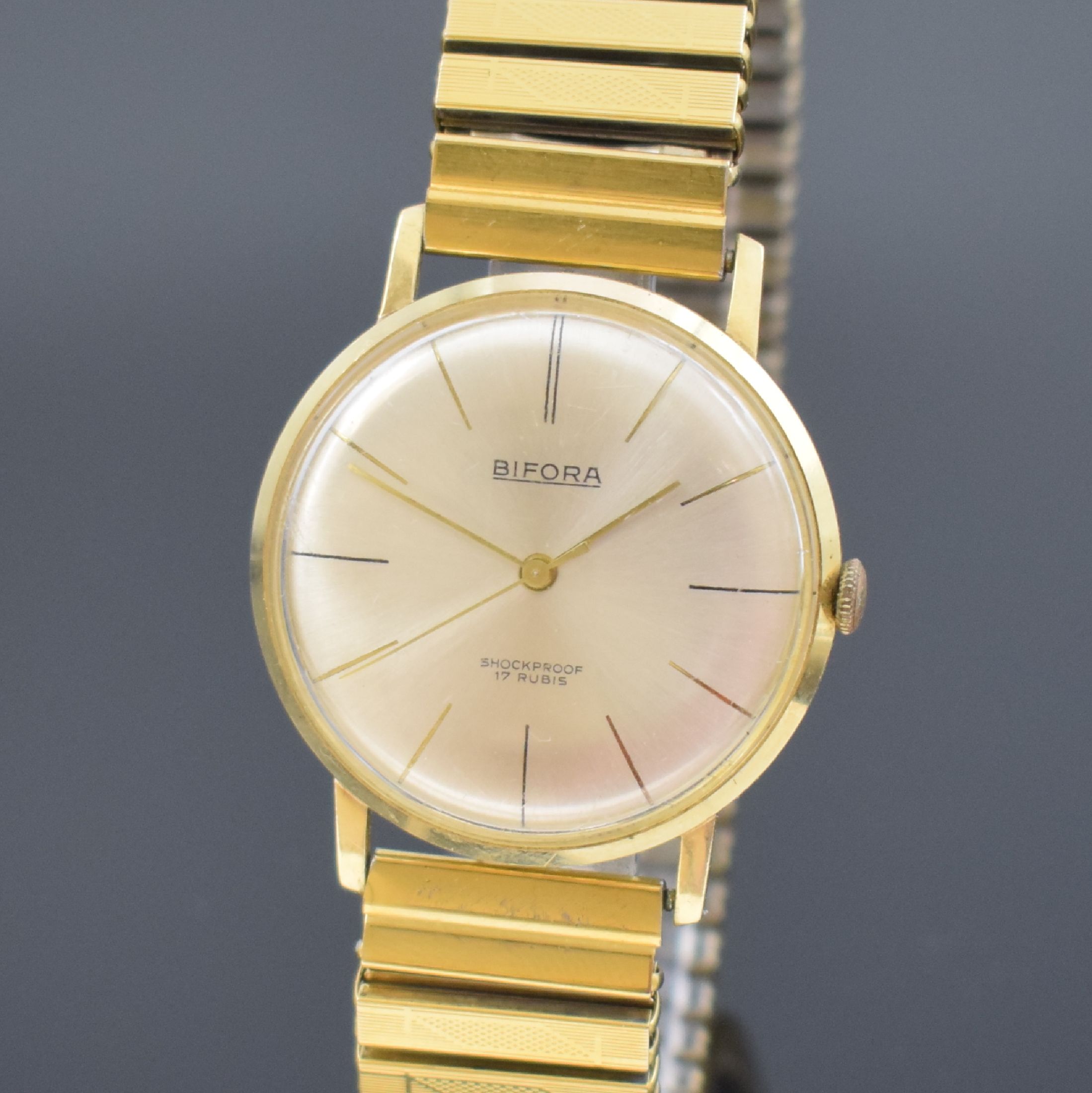 Detail a: BIFORA Herrenarmbanduhr in GG 585/000, Schweiz um 1970, Handaufzug, Boden aufgedr., verg. Flexband, silb. Zifferbl. m. gold. Std.-Ind., gold. Zeiger, ...